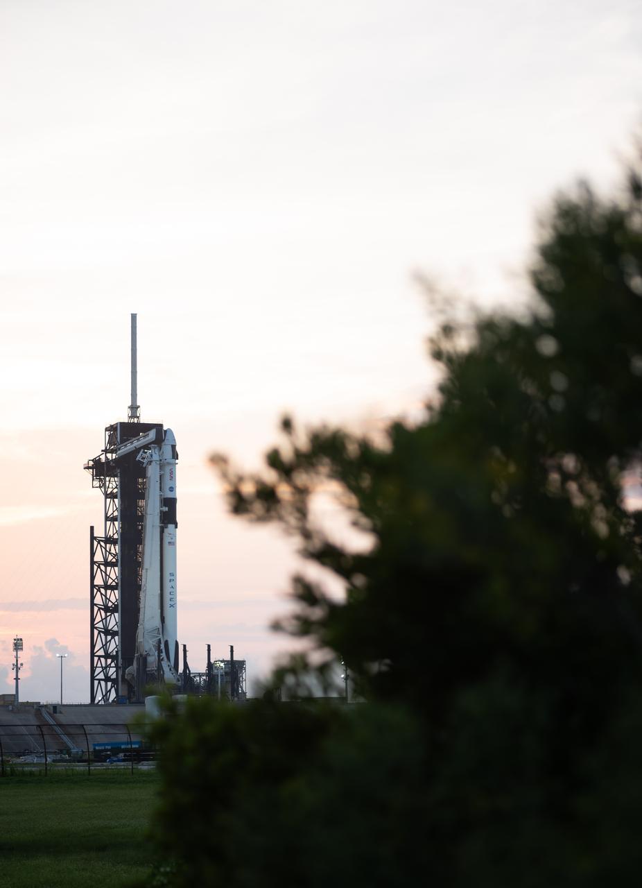 A SpaceX Falcon 9 rocket with the company's Dragon spacecraft on top is seen at sunset on the launch pad at Launch Complex 39A as preparations continue for the Crew-7 mission, Wednesday, Aug. 23, 2023, at NASA’s Kennedy Space Center in Florida. NASA’s SpaceX Crew-7 mission is the seventh crew rotation mission of the SpaceX Crew Dragon spacecraft and Falcon 9 rocket to the International Space Station as part of the agency’s Commercial Crew Program. NASA astronaut Jasmin Moghbeli, ESA (European Space Agency) astronaut Andreas Mogensen, Japan Aerospace Exploration Agency (JAXA) astronaut Satoshi Furukawa, and Roscosmos cosmonaut Konstantin Borisov are scheduled to launch at 3:50 a.m. EDT on Friday, August 25, from Launch Complex 39A at the Kennedy Space Center. Photo Credit: (NASA/Joel Kowsky)