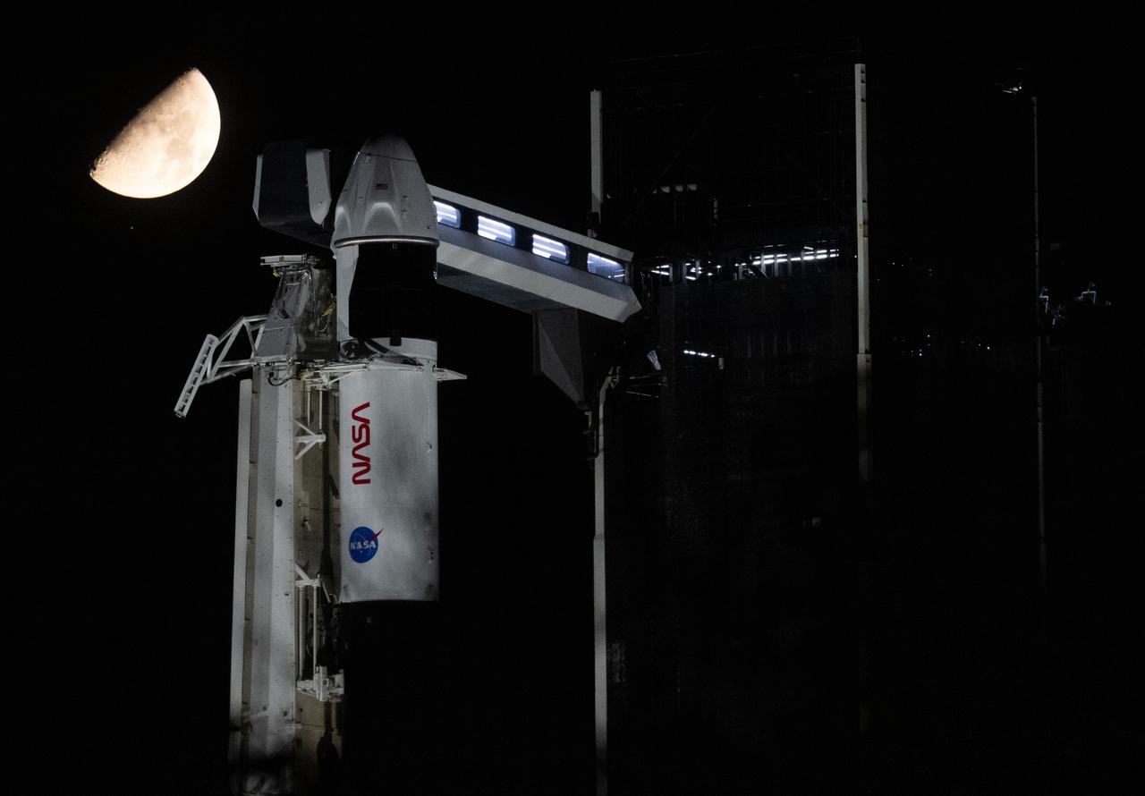 The Moon and the star Antares are seen in the sky above a SpaceX Falcon 9 rocket with the company's Dragon spacecraft on top is seen on the launch pad at Launch Complex 39A, Thursday, Aug. 24, 2023, at NASA’s Kennedy Space Center in Florida. NASA’s SpaceX Crew-7 mission is the seventh crew rotation mission of the SpaceX Crew Dragon spacecraft and Falcon 9 rocket to the International Space Station as part of the agency’s Commercial Crew Program. NASA astronaut Jasmin Moghbeli, ESA (European Space Agency) astronaut Andreas Mogensen, Japan Aerospace Exploration Agency (JAXA) astronaut Satoshi Furukawa, and Roscosmos cosmonaut Konstantin Borisov are scheduled to launch at 3:27 a.m. EDT on Saturday, August 26, from Launch Complex 39A at the Kennedy Space Center. Photo Credit: (NASA/Joel Kowsky)