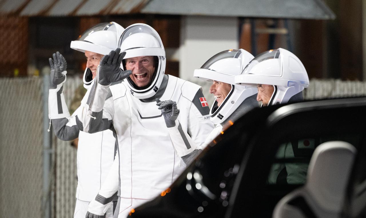 Roscosmos cosmonaut Konstantin Borisov, left, ESA (European Space Agency) astronaut Andreas Mogensen, second from left, NASA astronaut Jasmin Moghbeli, second from right, and Japan Aerospace Exploration Agency (JAXA) astronaut Satoshi Furukawa, right,  wearing SpaceX spacesuits, are seen as they prepare to depart the Neil  A. Armstrong Operations and Checkout Building for Launch Complex 39A to board the SpaceX Dragon spacecraft for the Crew-7 mission launch, Saturday, Aug. 26, 2023, at NASA’s Kennedy Space Center in Florida. NASA’s SpaceX Crew-7 mission is the seventh crew rotation mission of the SpaceX Crew Dragon spacecraft and Falcon 9 rocket to the International Space Station as part of the agency’s Commercial Crew Program. Moghbeli, Mogensen, Furukawa, and Borisov are scheduled to launch at 3:27am EDT on Friday, August 25, from Launch Complex 39A at the Kennedy Space Center.  Photo Credit: (NASA/Joel Kowsky)