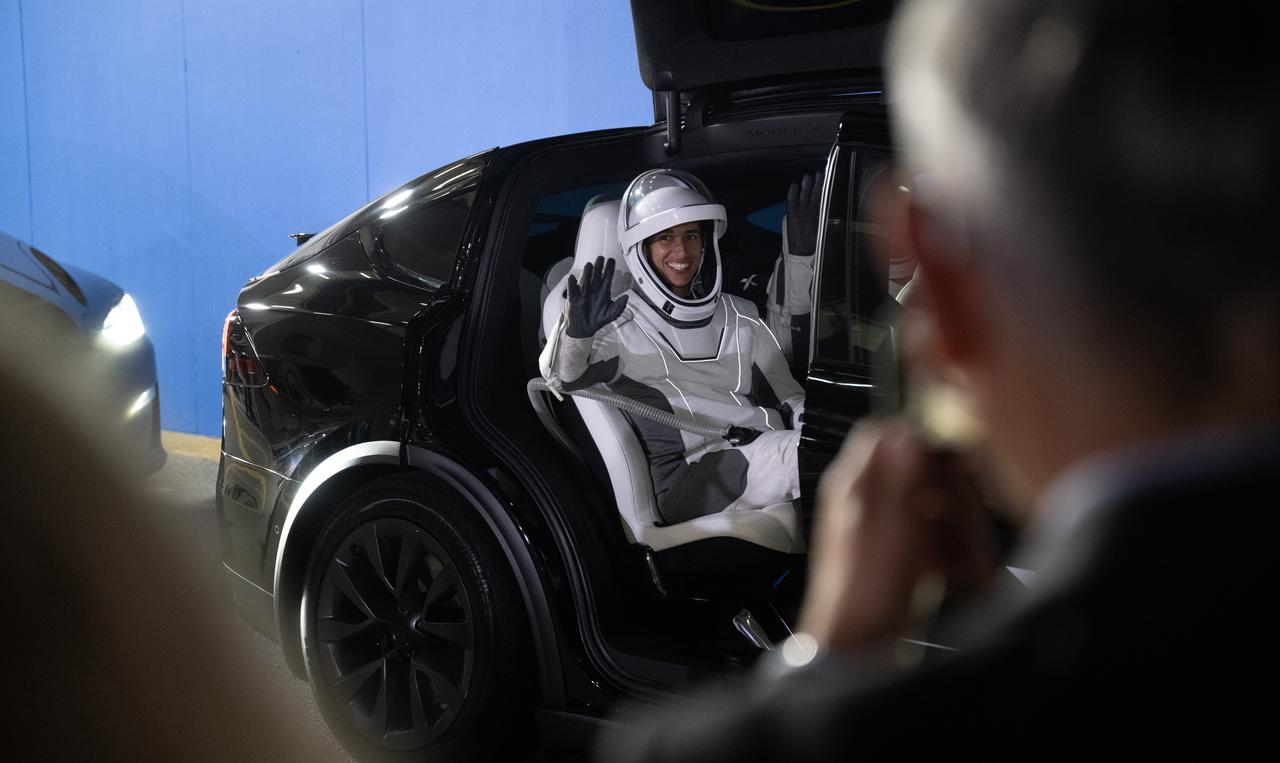 NASA astronaut Jasmin Moghbeli waves to NASA leadership as she and fellow crewmates Roscosmos cosmonaut Konstantin Borisov, ESA (European Space Agency) astronaut Andreas Mogensen, and Japan Aerospace Exploration Agency (JAXA) astronaut Satoshi Furukawa prepare to depart the Neil  A. Armstrong Operations and Checkout Building for Launch Complex 39A to board the SpaceX Dragon spacecraft for the Crew-7 mission launch, Saturday, Aug. 26, 2023, at NASA’s Kennedy Space Center in Florida. NASA’s SpaceX Crew-7 mission is the seventh crew rotation mission of the SpaceX Crew Dragon spacecraft and Falcon 9 rocket to the International Space Station as part of the agency’s Commercial Crew Program. Moghbeli, Mogensen, Furukawa, and Borisov are scheduled to launch at 3:27 a.m. EDT, from Launch Complex 39A at the Kennedy Space Center.  Photo Credit: (NASA/Joel Kowsky)