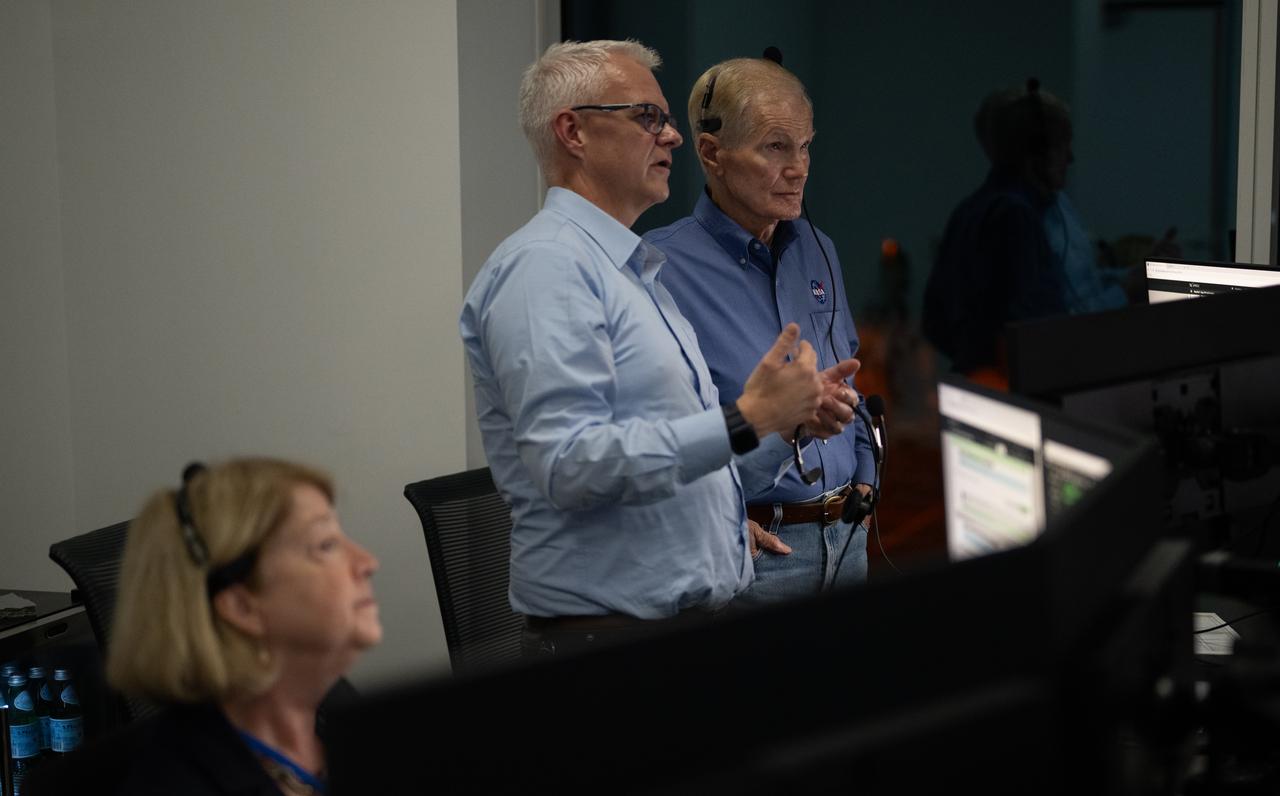 Benji Reed, senior director of Human Spaceflight Programs at SpaceX, center, talks with NASA Administrator Bill Nelson as they monitor the countdown of the launch of a SpaceX Falcon 9 rocket carrying the company's Dragon spacecraft on NASA’s SpaceX Crew-7 mission with NASA astronaut Jasmin Moghbeli, ESA (European Space Agency) astronaut Andreas Mogensen, Japan Aerospace Exploration Agency (JAXA) astronaut Satoshi Furukawa, and Roscosmos cosmonaut Konstantin Borisov onboard, Saturday, Aug. 26, 2023, in SpaceX’s Launch and Landing Control Center in HangerX at NASA’s Kennedy Space Center in Florida. NASA’s SpaceX Crew-7 mission is the first crew rotation mission of the SpaceX Dragon spacecraft and Falcon 9 rocket to the International Space Station as part of the agency’s Commercial Crew Program. Moghbeli, Mogensen, Furukawa, and Borisov launched at 3:27 a.m. EDT from Launch Complex 39A at the Kennedy Space Center. Photo Credit: (NASA/Joel Kowsky)