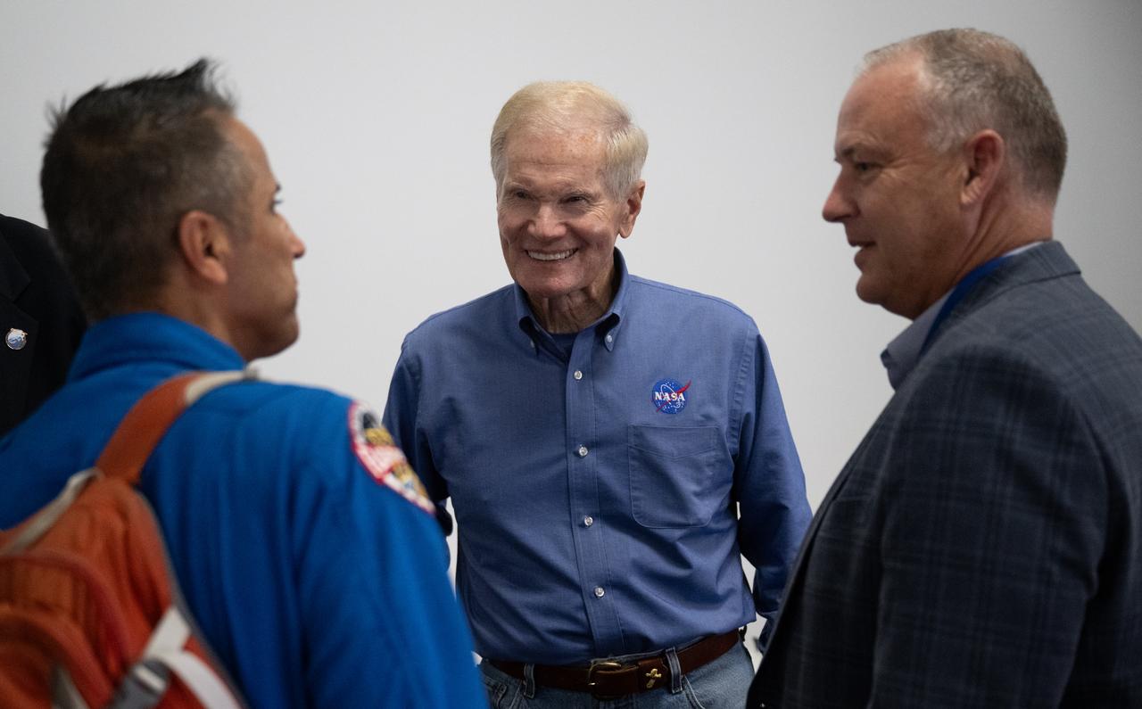 NASA Administrator Bill Nelson, center, speaks with Norm Knight, director of Flight Operations at NASA's Johnson Space Center, right, and Joe Acaba, Chief of the Astronaut Office, left,  following the launch of a SpaceX Falcon 9 rocket carrying the company's Dragon spacecraft on the Crew-7 mission with NASA astronaut Jasmin Moghbeli, ESA (European Space Agency) astronaut Andreas Mogensen, Japan Aerospace Exploration Agency (JAXA) astronaut Satoshi Furukawa, and Roscosmos cosmonaut Konstantin Borisov onboard, Saturday, Aug. 26, 2023, in the SpaceX’s Launch and Landing Control Center in HangerX at NASA’s Kennedy Space Center in Florida. NASA’s SpaceX Crew-7 mission is the seventh crew rotation mission of the SpaceX Dragon spacecraft and Falcon 9 rocket to the International Space Station as part of the agency’s Commercial Crew Program. Moghbeli, Mogensen, Furukawa, and Borisov launched at 3:27 a.m. EDT, from Launch Complex 39A at the Kennedy Space Center to begin a six month mission aboard the International Space Station. Photo Credit: (NASA/Joel Kowsky)