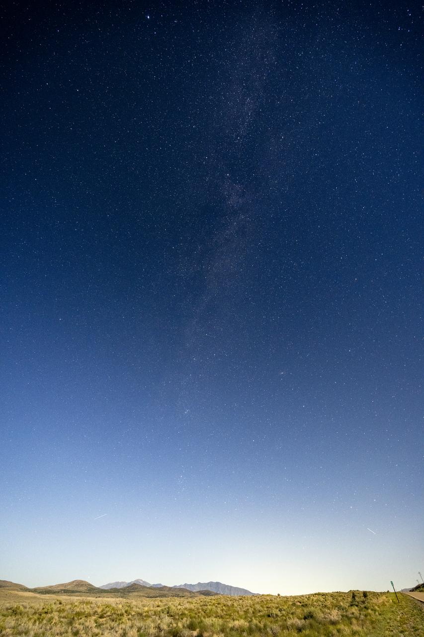 The Milky Way is seen above Dugway Proving Ground, Sunday, Aug. 27, 2023, near Dugway, Utah. Recovery teams met in August for rehearsals in preparation for the retrieval of the sample return capsule from NASA's OSIRIS-REx mission. The sample was collected from the asteroid Bennu in October 2020 by NASA’s OSIRIS-REx spacecraft and will return to Earth on September 24th, landing under parachute at the Utah Test and Training Range. Photo Credit: (NASA/Keegan Barber)