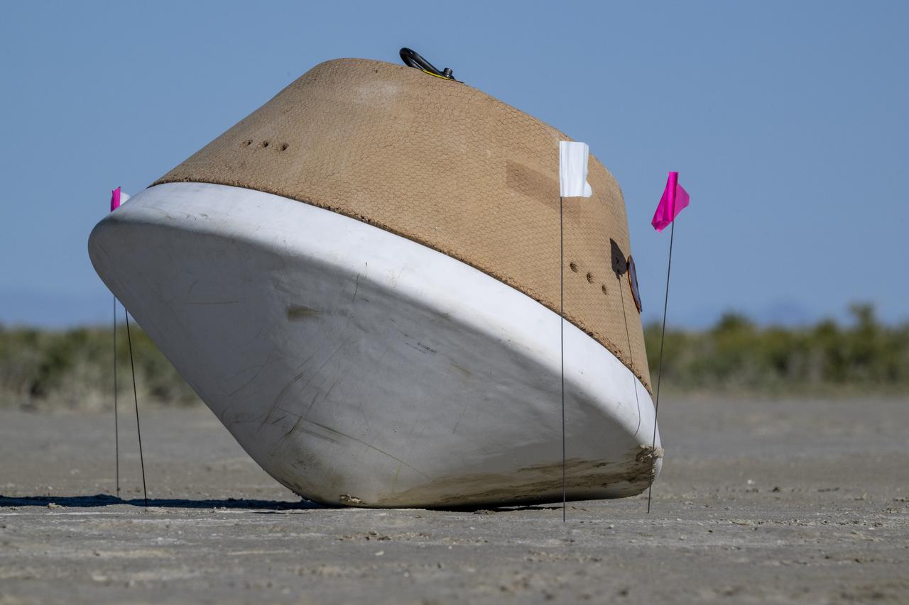 A training model of the sample return capsule is seen during field rehearsals in preparation for the retrieval of the sample return capsule from NASA's OSIRIS-REx mission, Tuesday, Aug. 29, 2023, at the Department of Defense's Utah Test and Training Range. The sample was collected from the asteroid Bennu in October 2020 by NASA’s OSIRIS-REx spacecraft and will return to Earth on September 24th, landing under parachute at the Utah Test and Training Range. Photo Credit: (NASA/Keegan Barber)