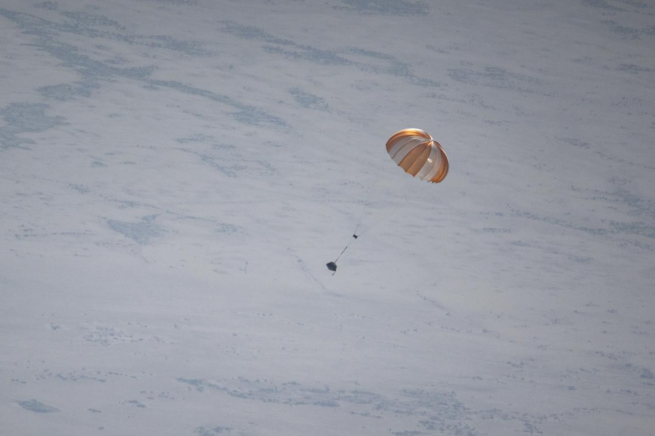 A training model of the sample return capsule is seen during a drop test in preparation for the retrieval of the sample return capsule from NASA's OSIRIS-REx mission, Wednesday, Aug. 30, 2023, at the Department of Defense's Utah Test and Training Range. The sample was collected from the asteroid Bennu in October 2020 by NASA’s OSIRIS-REx spacecraft and will return to Earth on September 24th, landing under parachute at the Utah Test and Training Range. Photo Credit: (NASA/Keegan Barber)