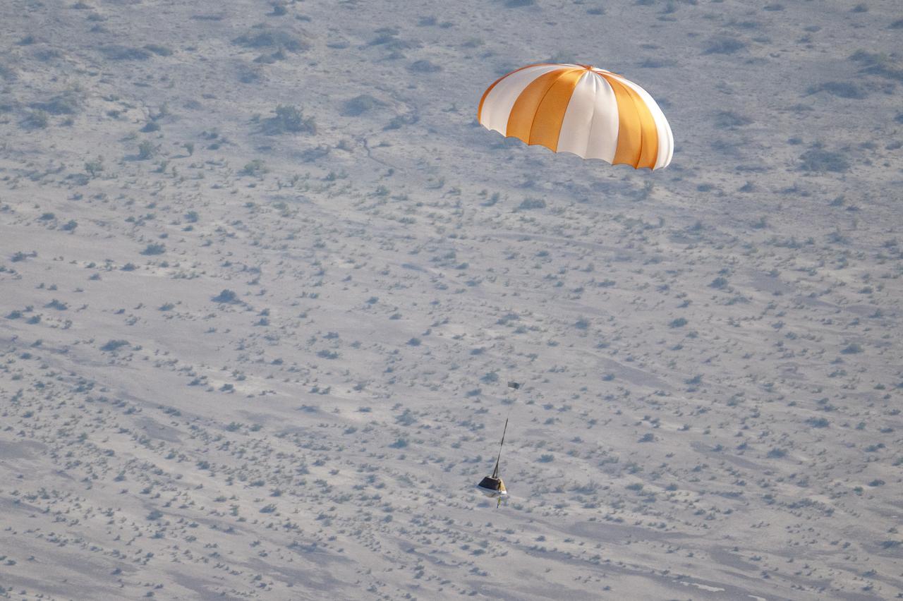 A training model of the sample return capsule is seen during a drop test in preparation for the retrieval of the sample return capsule from NASA's OSIRIS-REx mission, Wednesday, Aug. 30, 2023, at the Department of Defense's Utah Test and Training Range. The sample was collected from asteroid Bennu in October 2020 by NASA’s OSIRIS-REx spacecraft and will return to Earth on September 24th, landing under parachute at the Utah Test and Training Range. Photo Credit: (NASA/Keegan Barber)