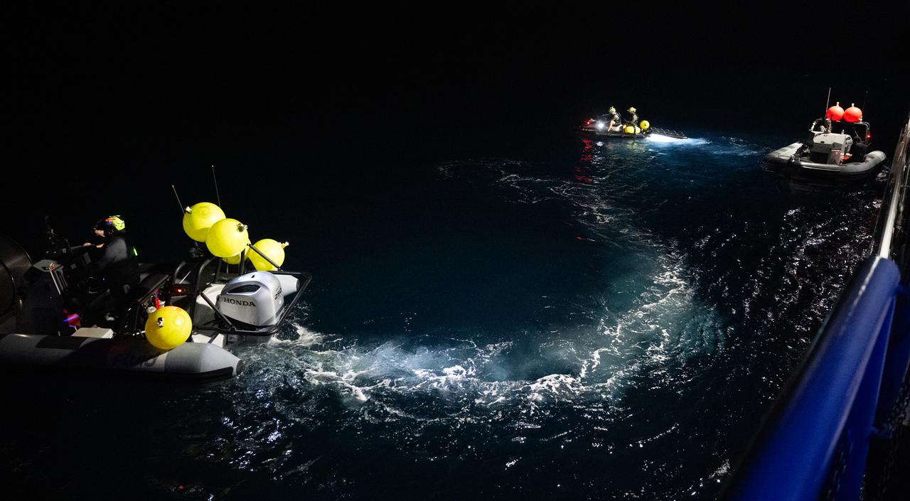 Fast boats and a jet ski with members of the SpaceX support team is seen after being deployed from the SpaceX recovery ship MEGAN in the Atlantic Ocean as the recovery team prepares for the landing of the SpaceX Dragon Endeavour spacecraft with NASA astronauts Stephen Bowen and Warren "Woody" Hoburg, UAE (United Arab Emirates) astronaut Sultan Alneyadi, and Roscosmos cosmonaut Andrey Fedyaev aboard, Sunday, Sept. 3, 2023, off the coast of Jacksonville, Florida. Bowen, Hoburg, Alneyadi, and Fedyaev are returning after nearly six-months days in space as part of Expedition 69 aboard the International Space Station. Photo Credit: (NASA/Joel Kowsky)