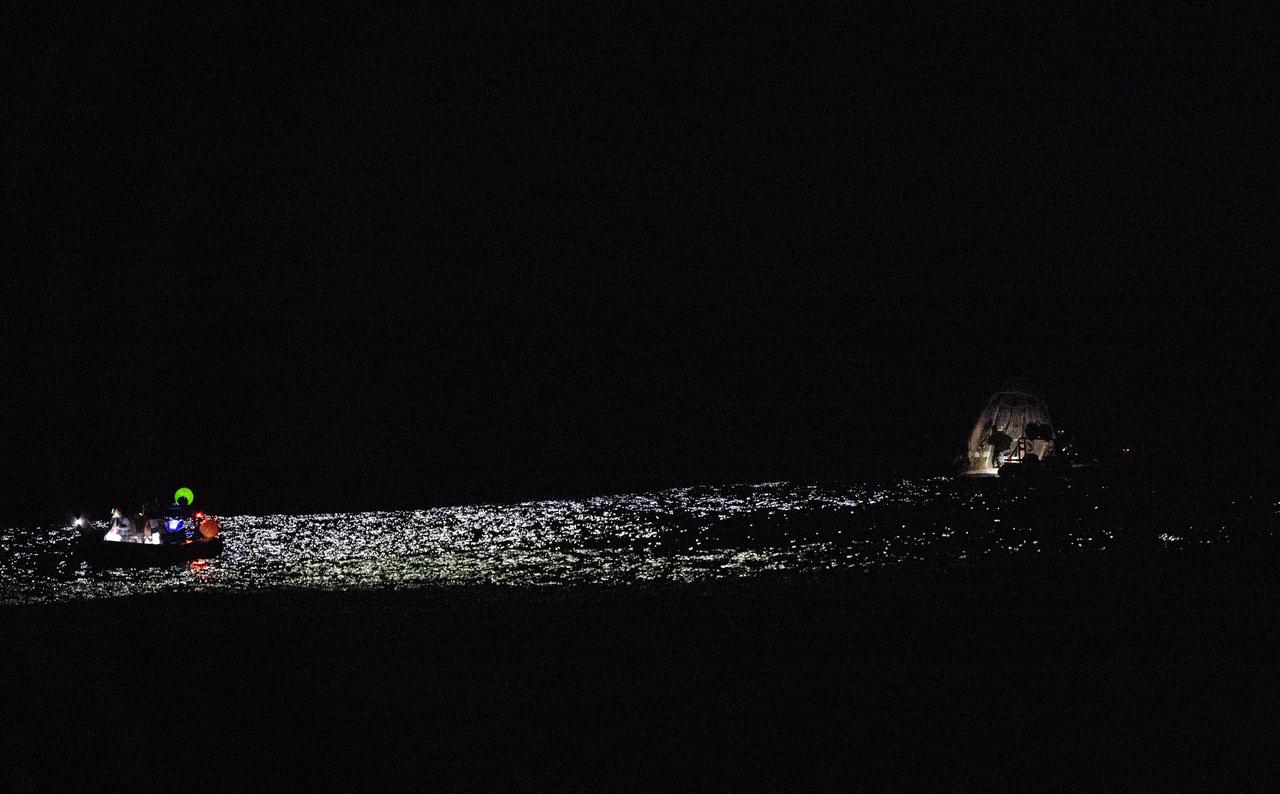 Support teams work around the SpaceX Dragon Endeavour spacecraft shortly after it landed with NASA astronauts Stephen Bowen and Warren "Woody" Hoburg, UAE (United Arab Emirates) astronaut Sultan Alneyadi, and Roscosmos cosmonaut Andrey Fedyaev aboard in the Atlantic Ocean off the coast of Jacksonville, Florida, Monday, Sept. 4,2023. Bowen, Hoburg, Alneyadi, and Fedyaev are returning after nearly six-months in space as part of Expedition 69 aboard the International Space Station. Photo Credit: (NASA/Joel Kowsky)