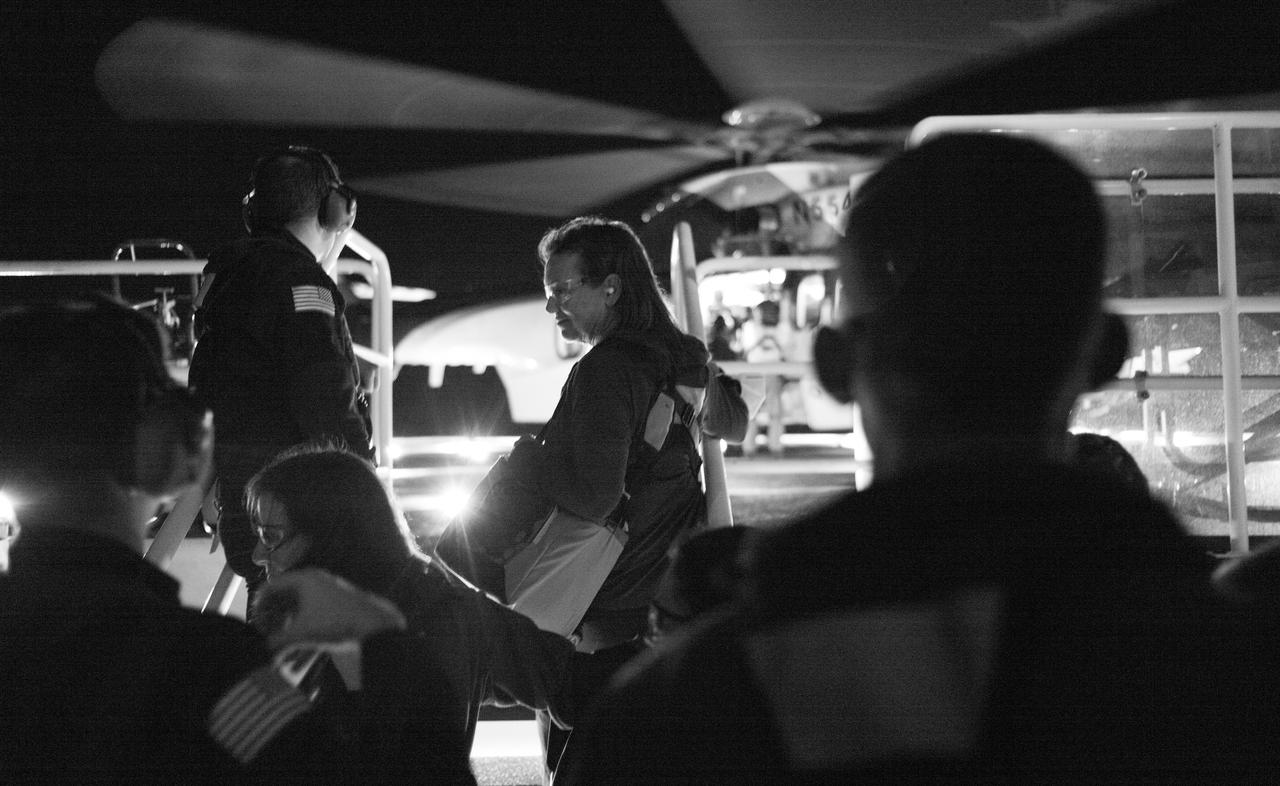 Dina Contella, operations integration manager for NASA's International Space Station Program Office, waits along with other support personnel to board a helicopter to return with NASA astronauts Stephen Bowen and Warren "Woody" Hoburg, UAE (United Arab Emirates) astronaut Sultan Alneyadi, and Roscosmos cosmonaut Andrey Fedyaev after the landing of the SpaceX Dragon Endeavour spacecraft, Monday, Sept. 4, 2023, onboard the SpaceX recovery ship MEGAN in the Atlantic Ocean off the coast of Jacksonville, Florida. Bowen, Hoburg, Alneyadi, and Fedyaev are landing in the Atlantic Ocean after nearly six-months in space as part of Expedition 69 aboard the International Space Station. Photo Credit: (NASA/Joel Kowsky)
