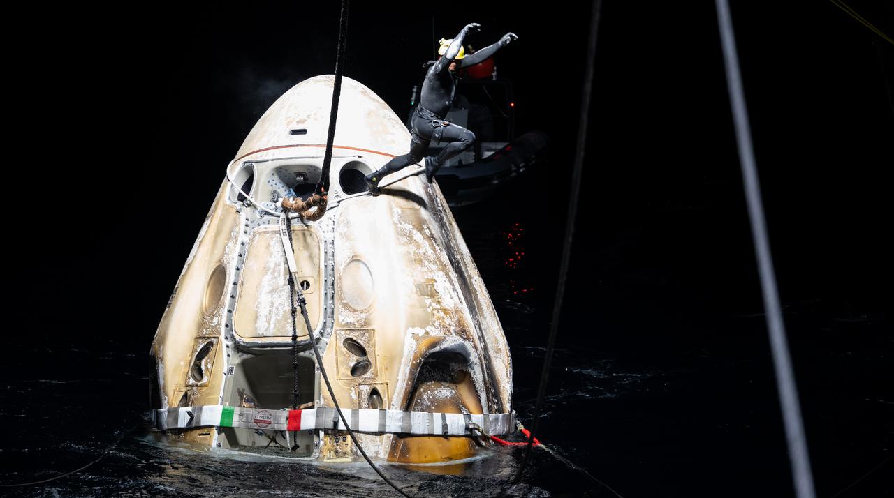 Support teams work around the SpaceX Dragon Endeavour spacecraft shortly after it landed with NASA astronauts Stephen Bowen and Warren "Woody" Hoburg, UAE (United Arab Emirates) astronaut Sultan Alneyadi, and Roscosmos cosmonaut Andrey Fedyaev aboard in the Atlantic Ocean off the coast of Jacksonville, Florida, Monday, Sept. 4,2023. Bowen, Hoburg, Alneyadi, and Fedyaev are returning after nearly six-months in space as part of Expedition 69 aboard the International Space Station. Photo Credit: (NASA/Joel Kowsky)