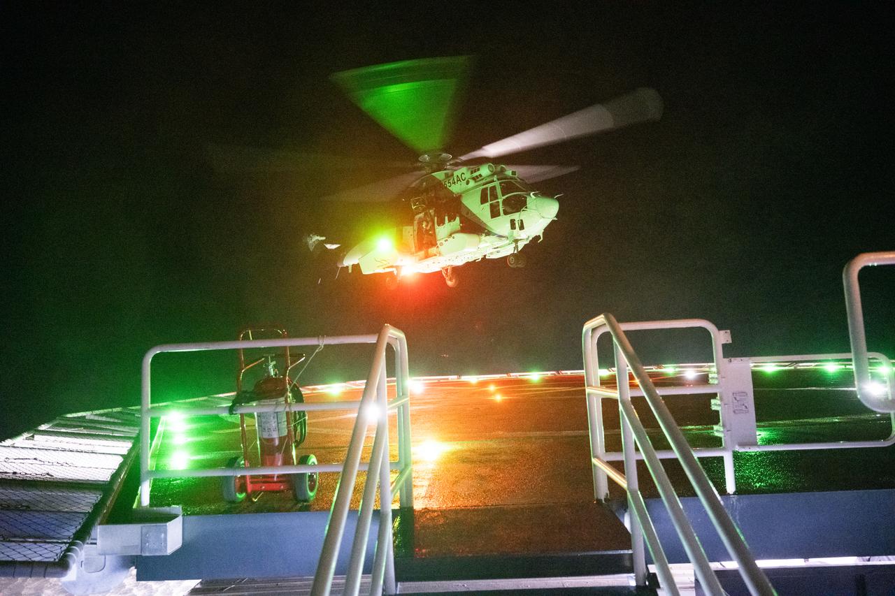 The helicopter that will carry NASA astronauts Stephen Bowen and Warren "Woody" Hoburg, UAE (United Arab Emirates) astronaut Sultan Alneyadi, and Roscosmos cosmonaut Andrey Fedyaev is seen as it lands on the SpaceX recovery ship MEGAN, Monday, Sept. 4, 2023, in the Atlantic Ocean off the coast of Jacksonville, Florida. Bowen, Hoburg, Alneyadi, and Fedyaev are landing in the Atlantic Ocean after nearly six-months in space as part of Expedition 69 aboard the International Space Station. Photo Credit: (NASA/Joel Kowsky)