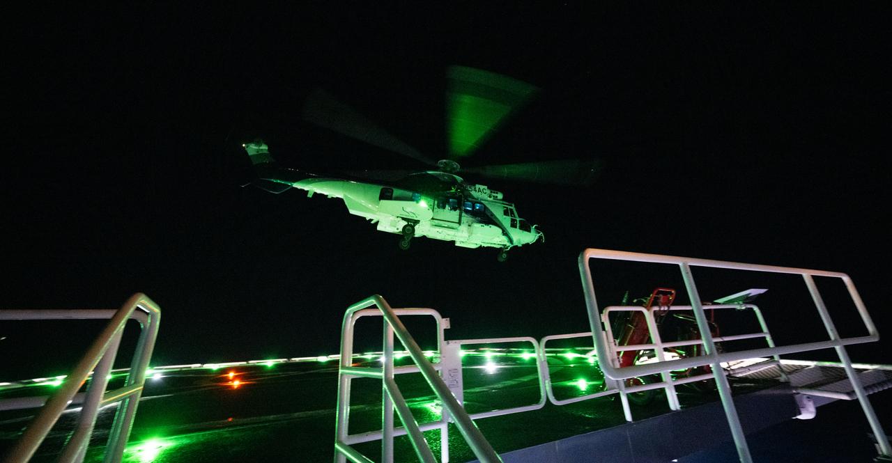 The helicopter with NASA astronauts Stephen Bowen and Warren "Woody" Hoburg, UAE (United Arab Emirates) astronaut Sultan Alneyadi, and Roscosmos cosmonaut Andrey Fedyaev is seen as it departs the SpaceX recovery ship MEGAN, Monday, Sept. 4, 2023, in the Atlantic Ocean off the coast of Jacksonville, Florida. Bowen, Hoburg, Alneyadi, and Fedyaev are landing in the Atlantic Ocean after nearly six-months in space as part of Expedition 69 aboard the International Space Station. Photo Credit: (NASA/Joel Kowsky)