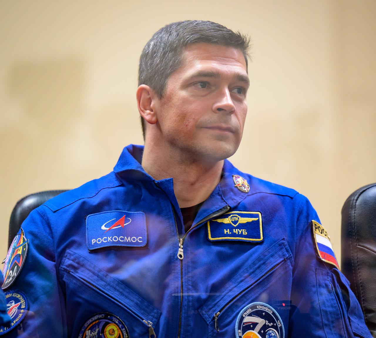 Expedition 70 cosmonauts Nikolai Chub is seen in quarantine behind glass during a press conference, Thursday, Sept. 14, 2023 at the Cosmonaut Hotel in Baikonur, Kazakhstan. Expedition 70 NASA astronaut Loral O'Hara, Roscosmos cosmonauts Oleg Kononenko, and Nikolai Chub are scheduled to launch aboard their Soyuz MS-24 spacecraft on Sept. 15. Photo Credit: (NASA/Bill Ingalls)