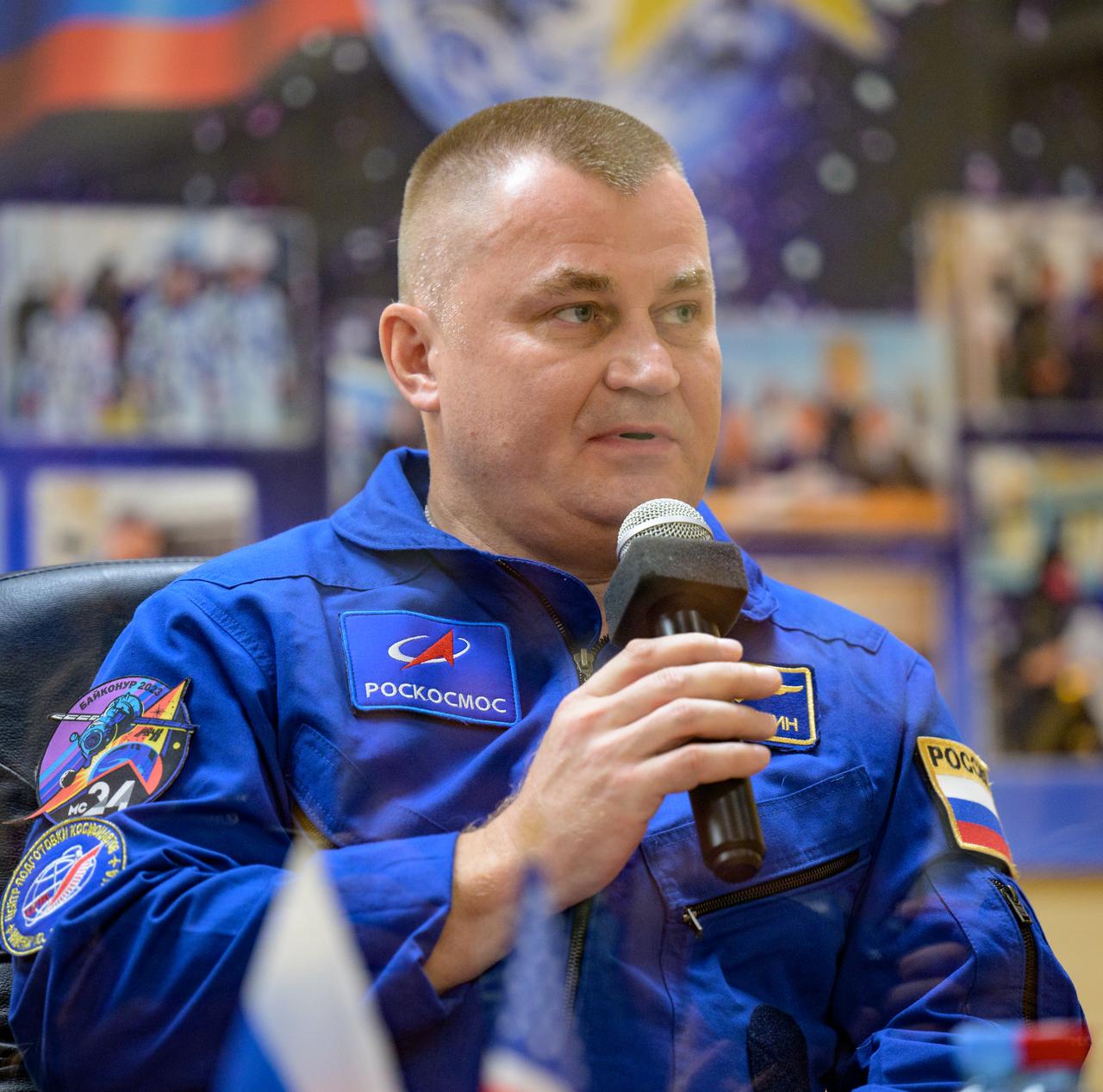 Expedition 70 backup cosmonaut Alexey Ovchinin is seen in quarantine behind glass during a press conference, Thursday, Sept. 14, 2023 at the Cosmonaut Hotel in Baikonur, Kazakhstan. Expedition 70 NASA astronaut Loral O'Hara, Roscosmos cosmonauts Oleg Kononenko, and Nikolai Chub are scheduled to launch aboard their Soyuz MS-24 spacecraft on Sept. 15. Photo Credit: (NASA/Bill Ingalls)