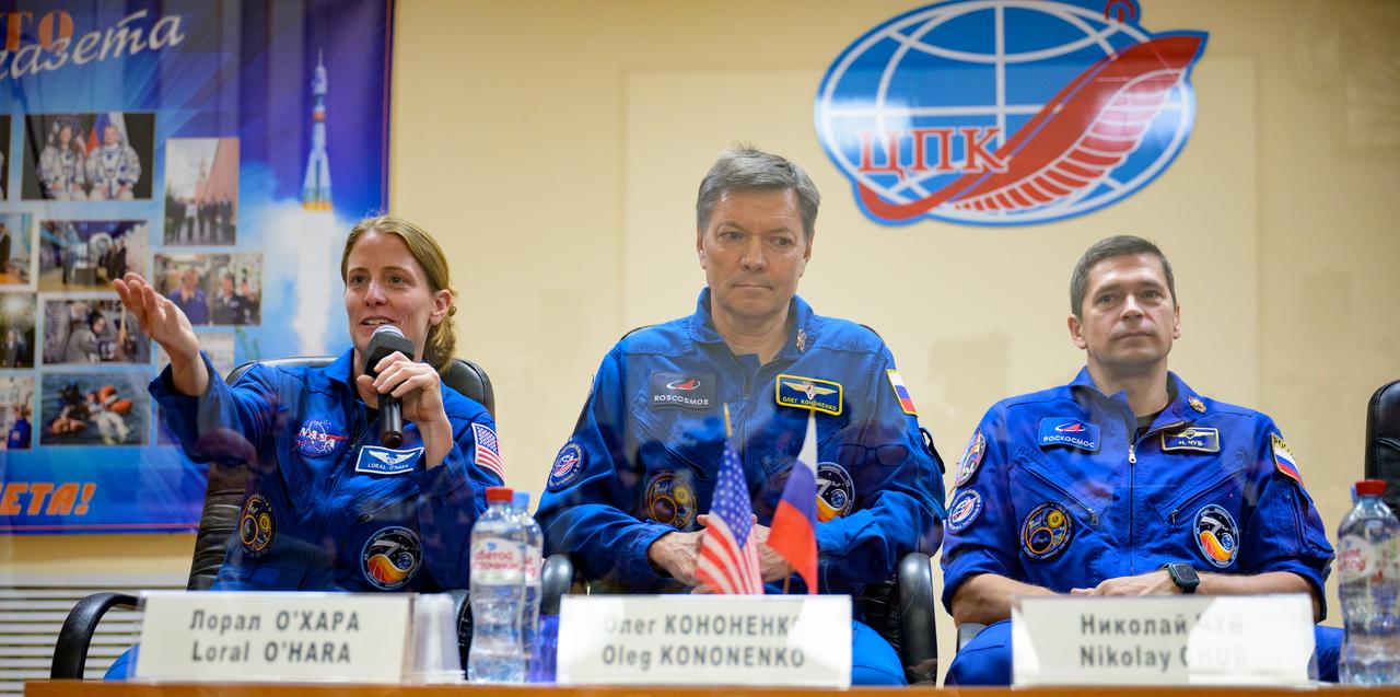 Expedition 70 NASA astronaut Loral O'Hara, left, Roscosmos cosmonauts Oleg Kononenko, and Nikolai Chub, right, are seen in quarantine behind glass during a press conference, Thursday, Sept. 14, 2023 at the Cosmonaut Hotel in Baikonur, Kazakhstan. O'Hara, Kononenko, Chub are scheduled to launch aboard their Soyuz MS-24 spacecraft on Sept. 15. Photo Credit: (NASA/Bill Ingalls)