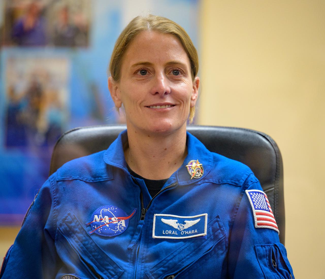 Expedition 70 astronaut Loral O'Hara is seen in quarantine behind glass during a press conference, Thursday, Sept. 14, 2023 at the Cosmonaut Hotel in Baikonur, Kazakhstan. Expedition 70 NASA astronaut Loral O'Hara, Roscosmos cosmonauts Oleg Kononenko, and Nikolai Chub are scheduled to launch aboard their Soyuz MS-24 spacecraft on Sept. 15. Photo Credit: (NASA/Bill Ingalls)