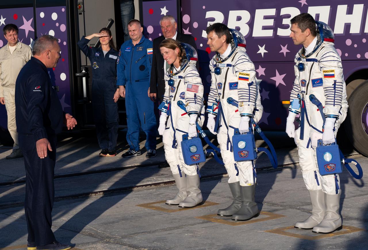 Expedition 70 crew members NASA astronaut Loral O’Hara, left, and Roscosmos cosmonauts Oleg Kononenko, center, and Nikolai Chub, right, check in with officials prior to boarding the Soyuz MS-24 spacecraft for launch, Friday, Sept. 15, 2023 at the Baikonur Cosmodrome in Kazakhstan. Launch of the Soyuz rocket will send the trio on a mission to the International Space Station. Photo Credit: (NASA/Bill Ingalls)