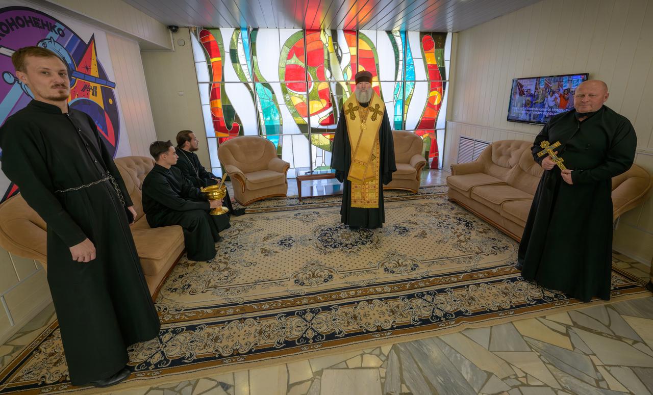 A Russian Orthodox priest waits for the Expedition 70 crew departure in the lobby of the Cosmonaut Hotel, Friday, Sept. 15, 2023, in Baikonur, Kazakhstan. Expedition 70 NASA astronaut Loral O'Hara and Roscosmos cosmonauts Oleg Kononenko and Nikolai Chub will launch on a mission to the International Space Station. Photo Credit: (NASA/Bill Ingalls)