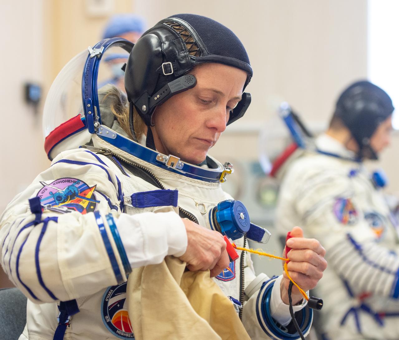 Expedition 70 NASA astronaut Loral O'Hara dons her Russian Sokol suit as she and fellow crewmates, Roscosmos cosmonauts Oleg Kononenko and Nikolai Chub, prepare for their Soyuz launch to the International Space Station, Friday, Sept. 15, 2023 in Baikonur, Kazakhstan. The launch will send Expedition 70 NASA astronaut Loral O'Hara and Roscosmos cosmonauts Oleg Kononenko and Nikolai Chub on a mission to the International Space Station. Photo Credit: (NASA/GCTC/Andrey Shelepin)