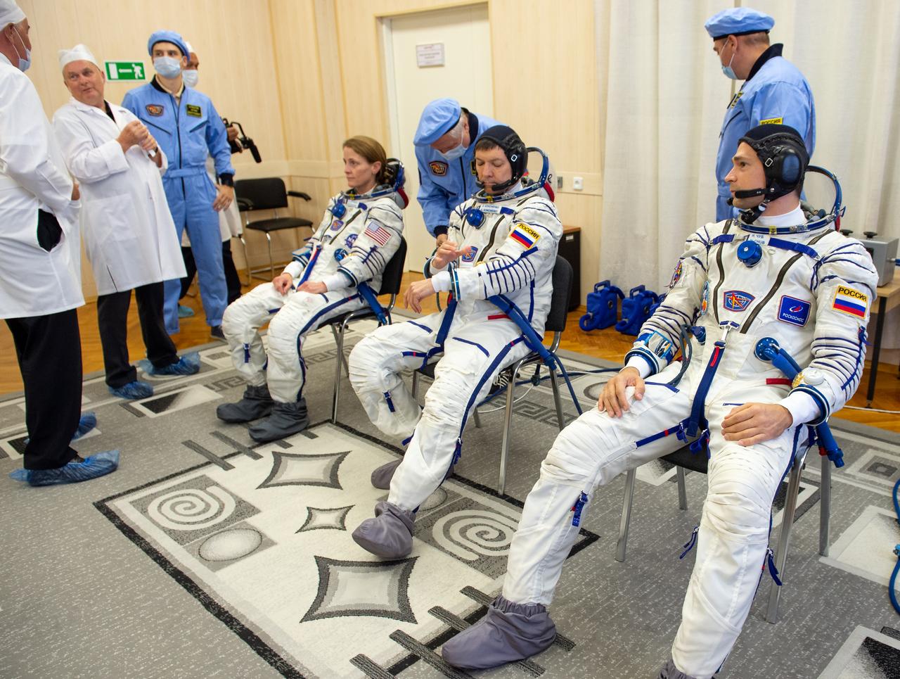 Expedition 70 NASA astronaut Loral O'Hara, left, Roscosmos cosmonauts Oleg Kononenko, center, and Nikolai Chub dons their Russian Sokol suit as they prepare for their Soyuz launch to the International Space Station, Friday, Sept. 15, 2023 in Baikonur, Kazakhstan. The launch will send Expedition 70 NASA astronaut Loral O'Hara and Roscosmos cosmonauts Oleg Kononenko and Nikolai Chub on a mission to the International Space Station. Photo Credit: (NASA/GCTC/Andrey Shelepin)