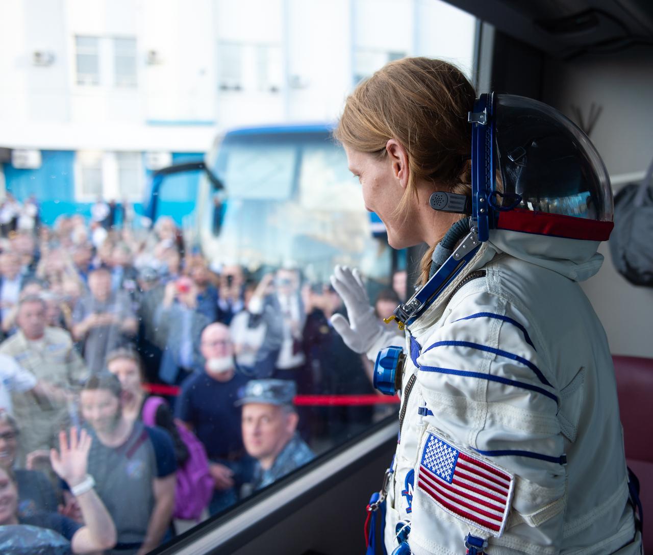 Expedition 70 NASA astronaut Loral O'Hara waves farewell to family and friends as she and fellow crewmates, Roscosmos cosmonauts Oleg Kononenko and Nikolai Chub, depart by bus to the launch pad for their Soyuz launch to the International Space Station, Friday, Sept. 15, 2023 in Baikonur, Kazakhstan. The launch will send Expedition 70 NASA astronaut Loral O'Hara and Roscosmos cosmonauts Oleg Kononenko and Nikolai Chub on a mission to the International Space Station. Photo Credit: (NASA/GCTC/Andrey Shelepin)