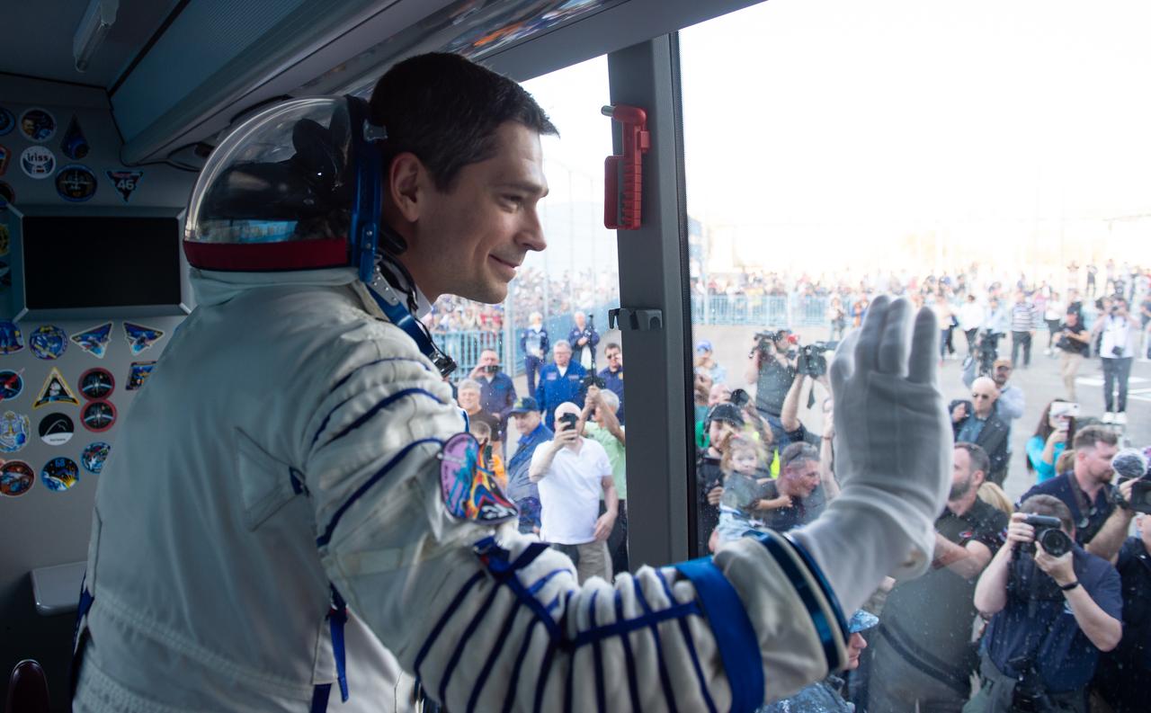 Expedition 70 Roscosmos cosmonaut Nikolai Chub waves farewell to family and friends as he and fellow crewmates, Roscosmos cosmonaut Oleg Kononenko and NASA astronaut Loral O'Hara, depart by bus to the launch pad for their Soyuz launch to the International Space Station, Friday, Sept. 15, 2023 in Baikonur, Kazakhstan. The launch will send Expedition 70 NASA astronaut Loral O'Hara and Roscosmos cosmonauts Oleg Kononenko and Nikolai Chub on a mission to the International Space Station. Photo Credit: (NASA/GCTC/Andrey Shelepin)