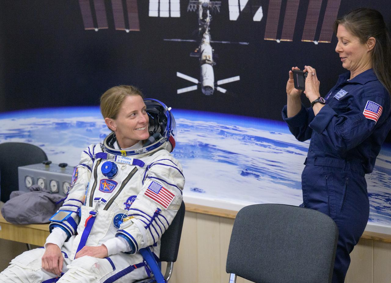 Expedition 70 NASA astronaut Loral O'Hara smiles as Expedition 70 backup crewmember Tracy Dyson of NASA takes her photograph while O’hara and fellow cremates, Roscosmos cosmonauts Oleg Kononenko and Nikolai Chub, have their Russian Sokol Suits pressure checked ahead of their Soyuz launch to the International Space Station Friday, Sept. 15, 2023 in Baikonur, Kazakhstan. The launch will send Expedition 70 NASA astronaut Loral O'Hara and Roscosmos cosmonauts Oleg Kononenko and Nikolai Chub on a mission to the International Space Station. Photo Credit: (NASA/Bill Ingalls)