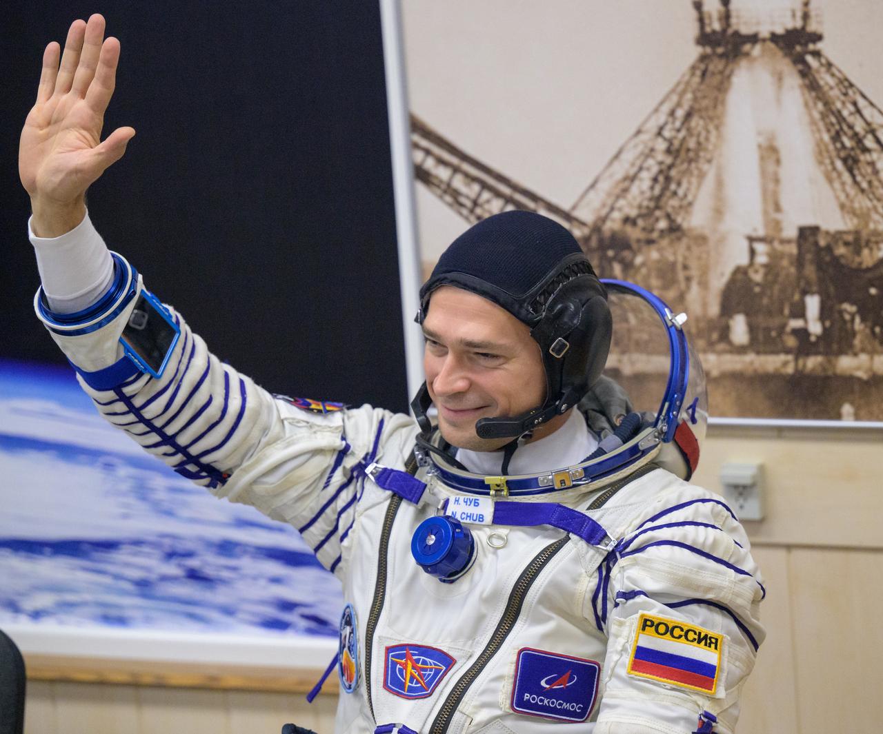 Expedition 70 Roscosmos cosmonaut Nikolai Chub waves to family as he and fellow cremates, Roscosmos cosmonaut Oleg Kononenko and NASA astronaut Loral O'Hara, have their Russian Sokol Suits pressure checked ahead of their Soyuz launch to the International Space Station Friday, Sept. 15, 2023 in Baikonur, Kazakhstan. The launch will send Expedition 70 NASA astronaut Loral O'Hara and Roscosmos cosmonauts Oleg Kononenko and Nikolai Chub on a mission to the International Space Station. Photo Credit: (NASA/Bill Ingalls)
