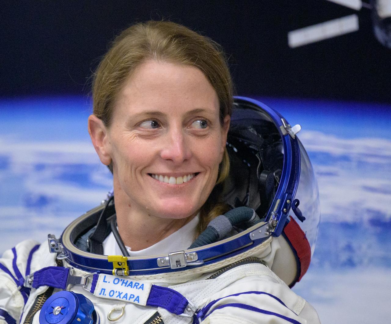 Expedition 70 NASA astronaut Loral O'Hara smiles to Expedition 70 backup crewmember Tracy Dyson of NASA as she and fellow cremates, Roscosmos cosmonauts Oleg Kononenko and Nikolai Chub, have their Russian Sokol Suits pressure checked ahead of their Soyuz launch to the International Space Station Friday, Sept. 15, 2023 in Baikonur, Kazakhstan. The launch will send Expedition 70 NASA astronaut Loral O'Hara and Roscosmos cosmonauts Oleg Kononenko and Nikolai Chub on a mission to the International Space Station. Photo Credit: (NASA/Bill Ingalls)