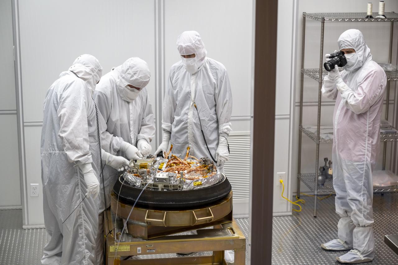 Curation teams process the sample return capsule from NASA’s OSIRIS-REx mission in a cleanroom, Sunday, Sept. 24, 2023, at the Department of Defense's Utah Test and Training Range. The sample was collected from the asteroid Bennu in October 2020 by NASA’s OSIRIS-REx spacecraft. Photo Credit: (NASA/Keegan Barber)