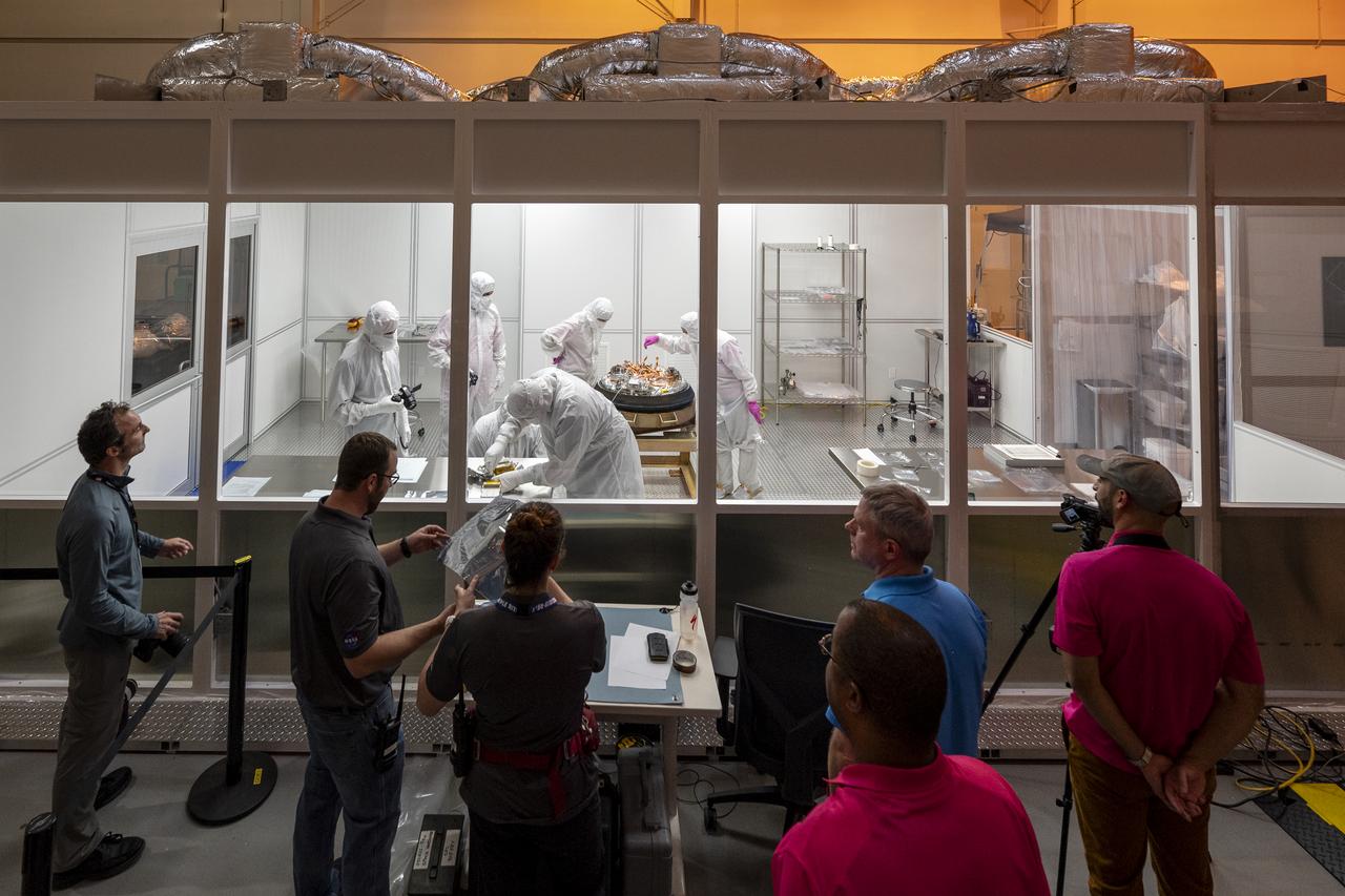 Curation teams process the sample return capsule from NASA’s OSIRIS-REx mission in a cleanroom, Sunday, Sept. 24, 2023, at the Department of Defense's Utah Test and Training Range. The sample was collected from the asteroid Bennu in October 2020 by NASA’s OSIRIS-REx spacecraft. Photo Credit: (NASA/Keegan Barber)