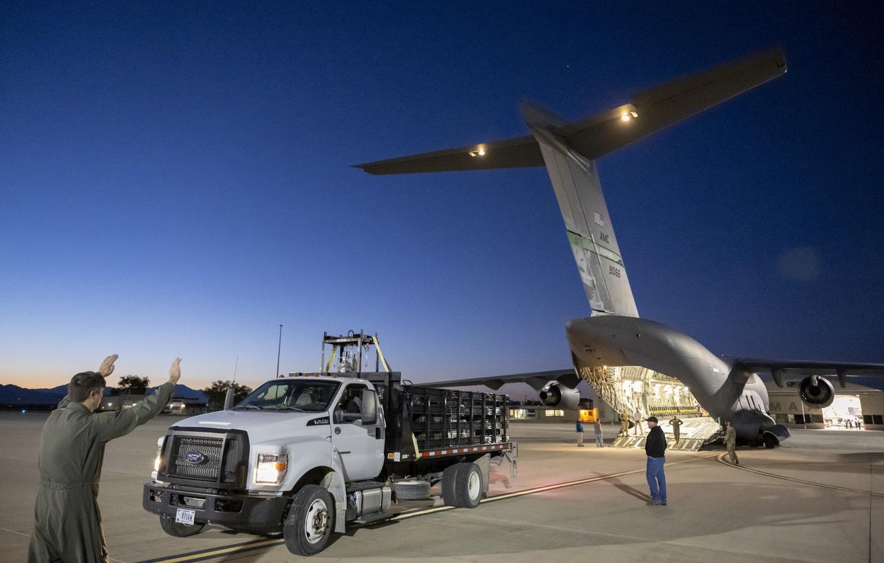 Recovery team members load a container with the science canister from NASA’s OSIRIS-REx mission onto a C-17 Globemaster aircraft, Monday, Sept. 25, 2023, at the Department of Defense's Utah Test and Training Range. The sample was collected from the asteroid Bennu in October 2020 by NASA’s OSIRIS-REx spacecraft. Photo Credit: (NASA/Keegan Barber)