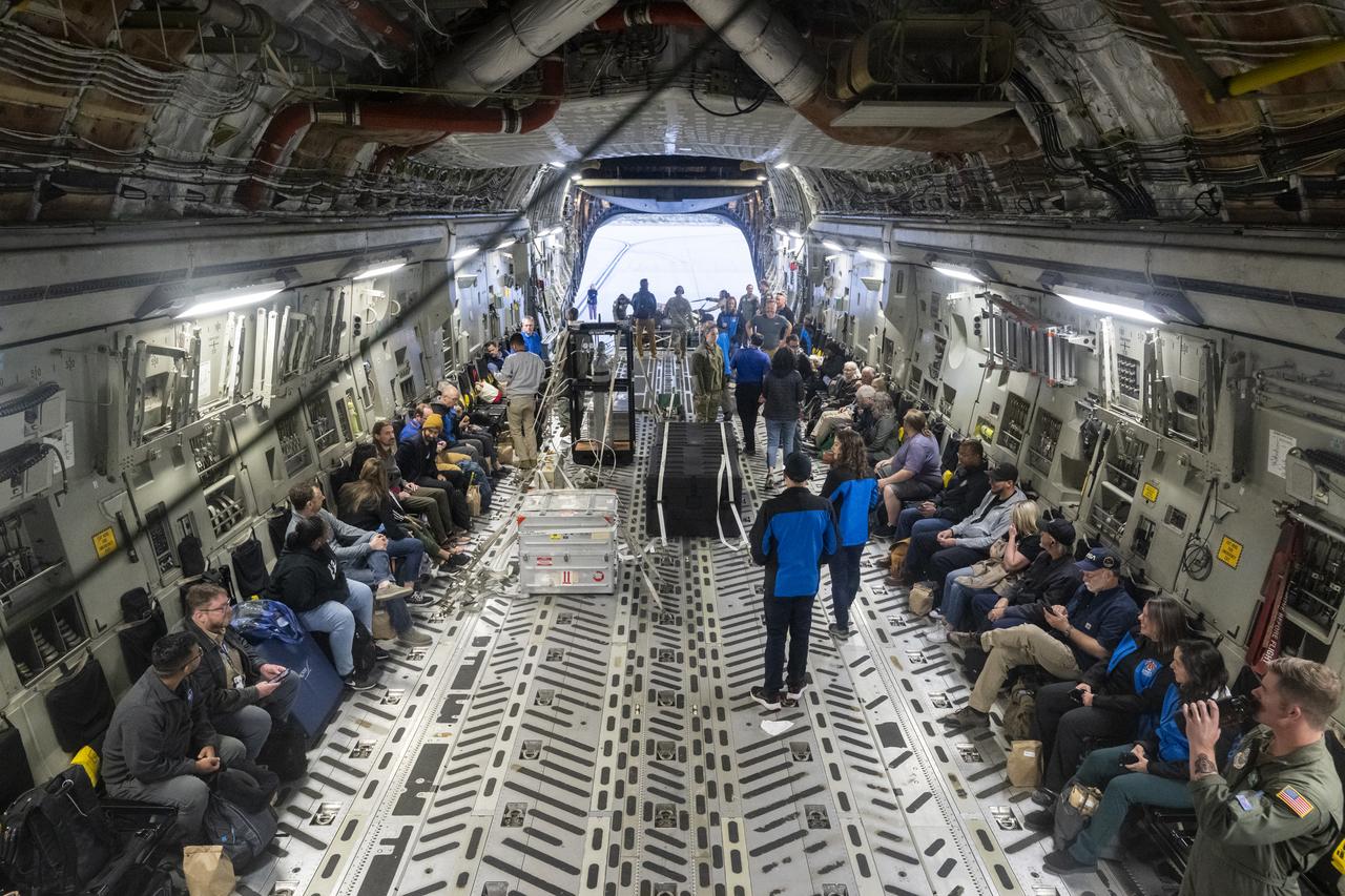 Recovery and curation teams join a container with the science canister from NASA’s OSIRIS-REx mission aboard a C-17 Globemaster aircraft, Monday, Sept. 25, 2023, at the Department of Defense's Utah Test and Training Range. The sample was collected from the asteroid Bennu in October 2020 by NASA’s OSIRIS-REx spacecraft. Photo Credit: (NASA/Keegan Barber)