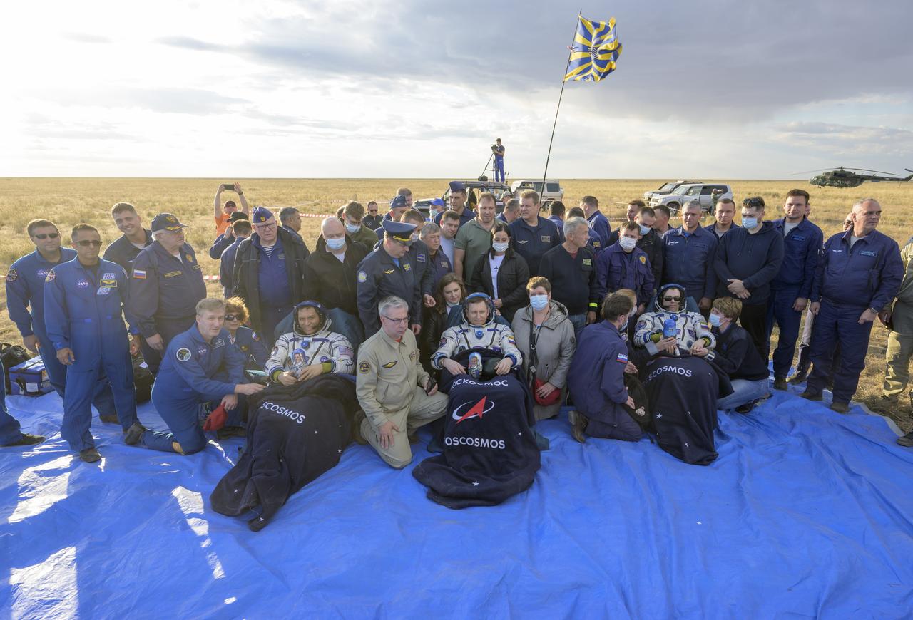 Expedition 69 NASA astronaut Frank Rubio left, Roscosmos cosmonauts Sergey Prokopyev, center, and Dmitri Petelin sit in chairs outside the Soyuz MS-23 spacecraft after they landed in a remote area near the town of Zhezkazgan, Kazakhstan on Wednesday, Sept. 27, 2023. The trio are returning to Earth after logging 371 days in space as members of Expeditions 68-69 aboard the International Space Station. For Rubio, his mission is the longest single spaceflight by a U.S. astronaut in history. Photo Credit: (NASA/Bill Ingalls)