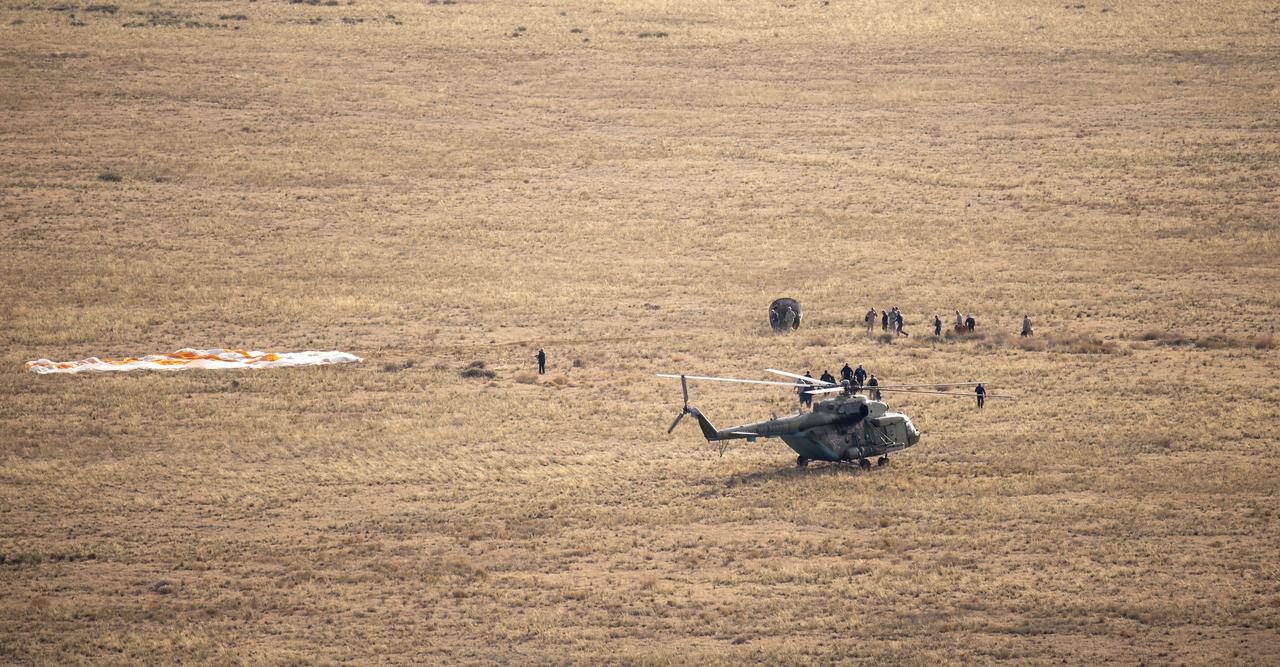Russian Search and Rescue teams arrive at the Soyuz MS-23 spacecraft shortly after it landed in a remote area near the town of Zhezkazgan, Kazakhstan with Expedition 69 NASA astronaut Frank Rubio, Roscosmos cosmonauts Dmitri Petelin and Sergey Prokopyev, Wednesday, Sept. 27, 2023. The trio are returning to Earth after logging 371 days in space as members of Expeditions 68-69 aboard the International Space Station. For Rubio, his mission is the longest single spaceflight by a U.S. astronaut in history. Photo Credit: (NASA/GCTC/Pavel Shvets)