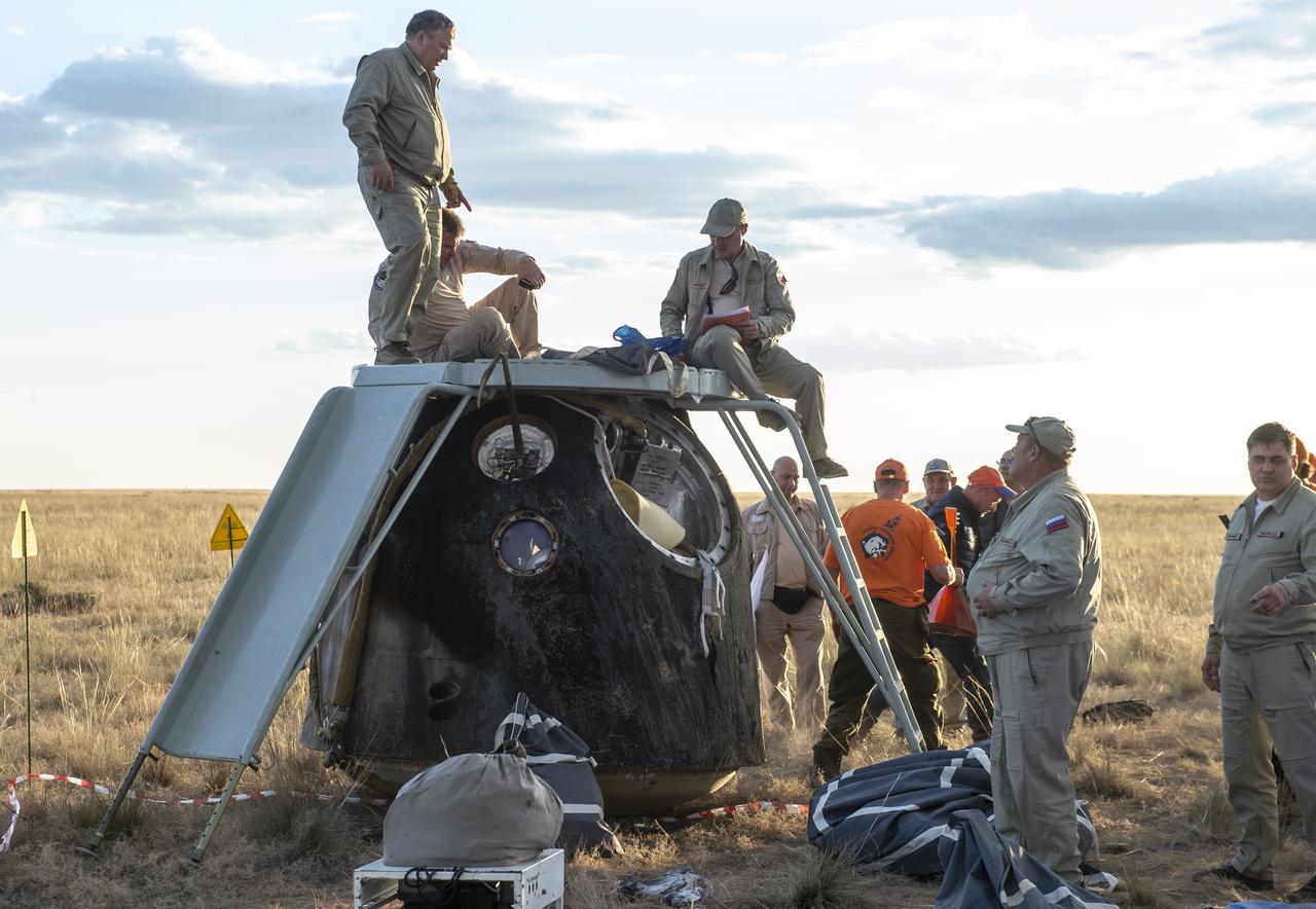 Russian support personnel work around the Soyuz MS-23 spacecraft shortly after it landed n a remote area near the town of Zhezkazgan, Kazakhstan with Expedition 69 NASA astronaut Frank Rubio, and Roscosmos cosmonauts Dmitri Petelin, and Sergey Prokopyev, Wednesday, Sept. 27, 2023. The trio are returning to Earth after logging 371 days in space as members of Expeditions 68-69 aboard the International Space Station. For Rubio, his mission is the longest single spaceflight by a U.S. astronaut in history. Photo Credit: (NASA/GCTC/Pavel Shvets)