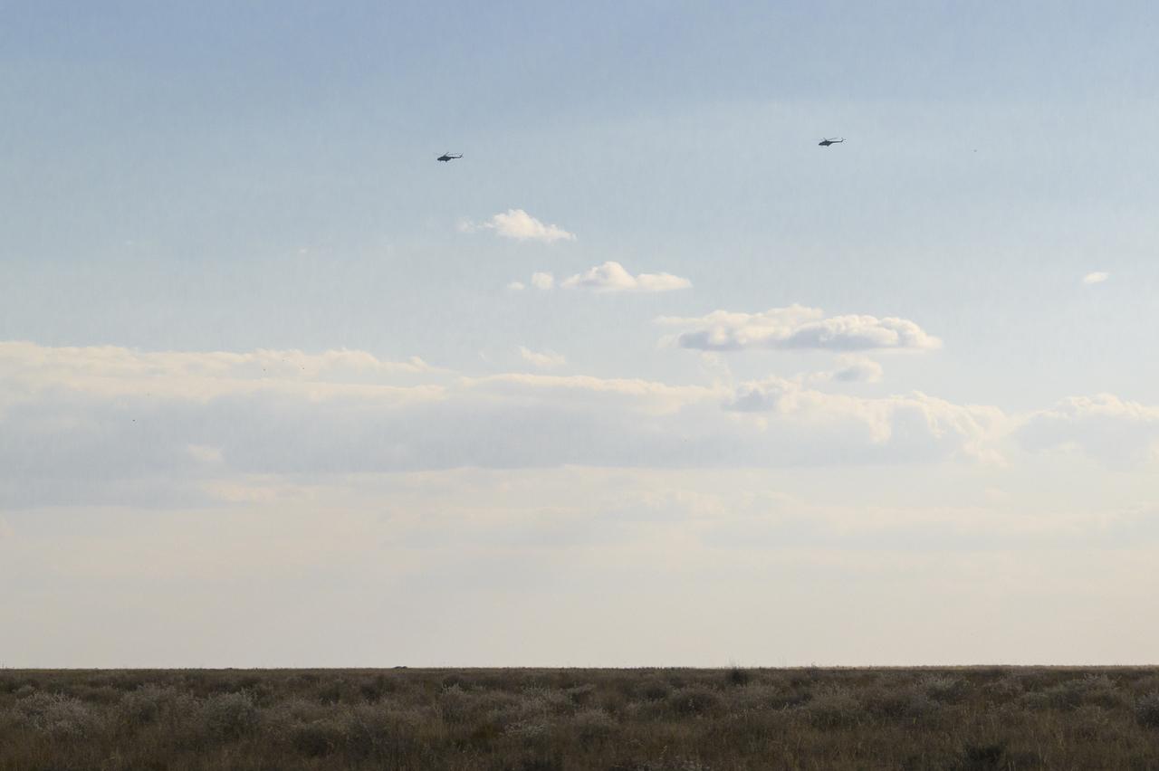 Russian Search and Recovery Force helicopters fly around the predicted landing zone for the Soyuz MS-23 capsule with Expedition 69 NASA astronaut Frank Rubio, Roscosmos cosmonauts Dmitri Petelin and Sergey Prokopyev, Wednesday, Sept. 27, 2023, outside of Zhezkazgan, Kazakhstan. The trio are returning to Earth after logging 371 days in space as members of Expeditions 68-69 aboard the International Space Station. For Rubio, his mission is the longest single spaceflight by a U.S. astronaut in history. Photo Credit: (NASA/Bill Ingalls)