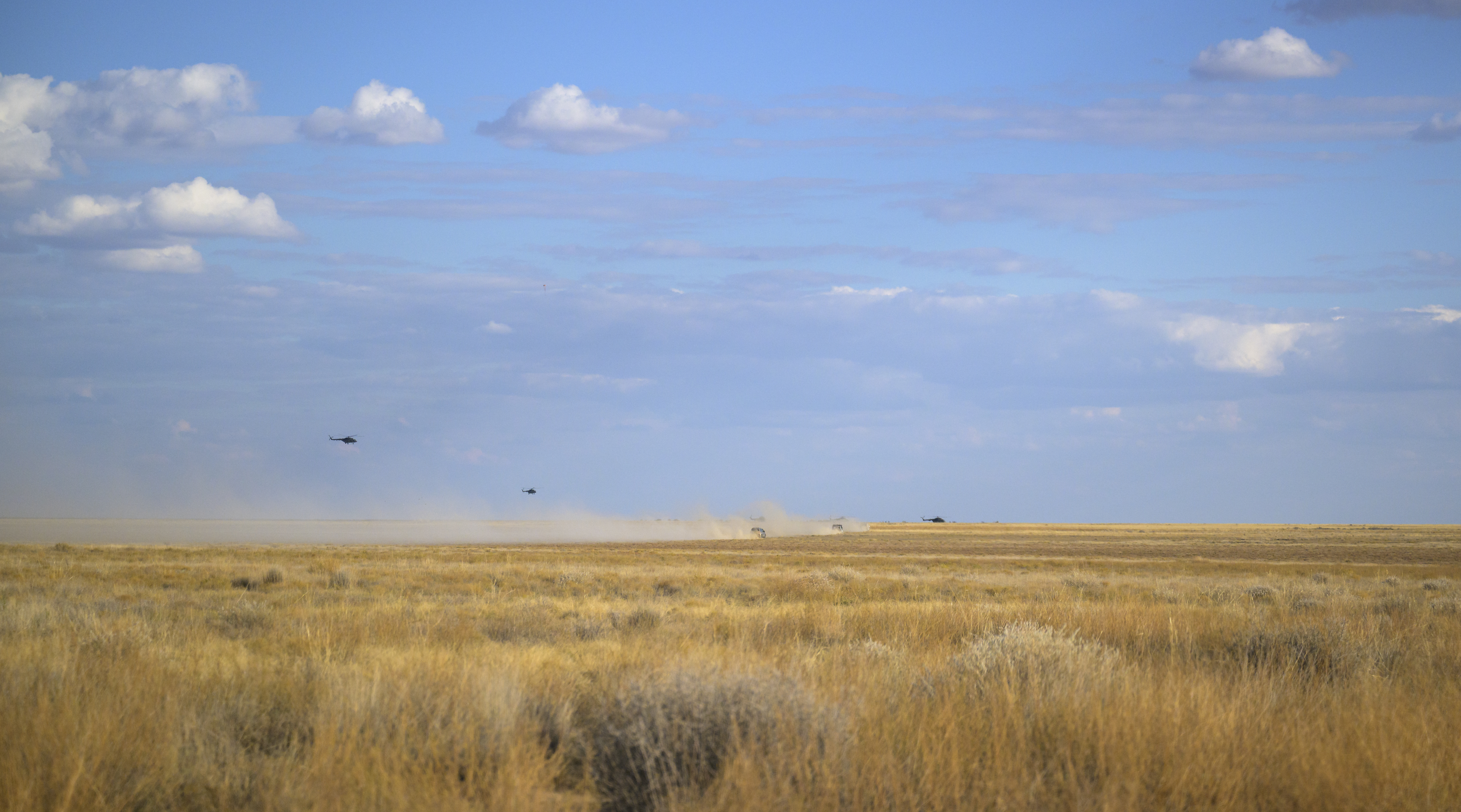 Russian Search and Rescue teams arrive at the Soyuz MS-23 spacecraft shortly after it landed in a remote area near the town of Zhezkazgan, Kazakhstan with Expedition 69 NASA astronaut Frank Rubio, Roscosmos cosmonauts Dmitri Petelin and Sergey Prokopyev, Wednesday, Sept. 27, 2023. The trio are returning to Earth after logging 371 days in space as members of Expeditions 68-69 aboard the International Space Station. For Rubio, his mission is the longest single spaceflight by a U.S. astronaut in history. Photo Credit: (NASA/Bill Ingalls)