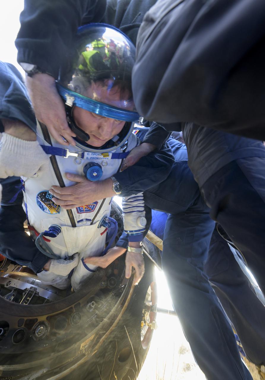 Expedition 69 Roscosmos cosmonaut Sergey Prokopyev is helped out of the Soyuz MS-23 spacecraft just minutes after he and Roscosmos cosmonaut Dmitri Petelin and NASA astronaut Frank Rubio, landed in a remote area near the town of Zhezkazgan, Kazakhstan on Wednesday, Sept. 27, 2023. The trio are returning to Earth after logging 371 days in space as members of Expeditions 68-69 aboard the International Space Station. For Rubio, his mission is the longest single spaceflight by a U.S. astronaut in history. Photo Credit: (NASA/Bill Ingalls)