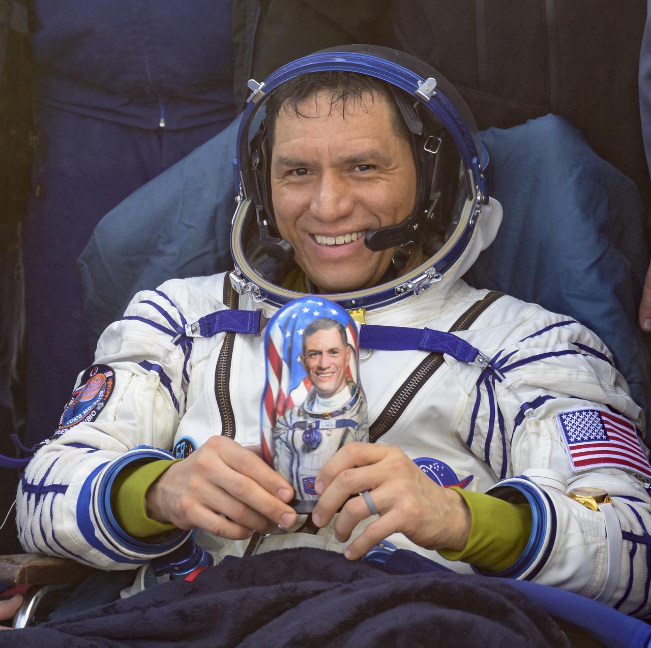 Expedition 69 NASA astronaut Frank Rubio holds a matryoshka doll he was gifted outside the Soyuz MS-23 spacecraft after he landed with Roscosmos cosmonauts Dmitri Petelin and Sergey Prokopyev, in a remote area near the town of Zhezkazgan, Kazakhstan on Wednesday, Sept. 27, 2023. The trio are returning to Earth after logging 371 days in space as members of Expeditions 68-69 aboard the International Space Station. For Rubio, his mission is the longest single spaceflight by a U.S. astronaut in history. Photo Credit: (NASA/Bill Ingalls)