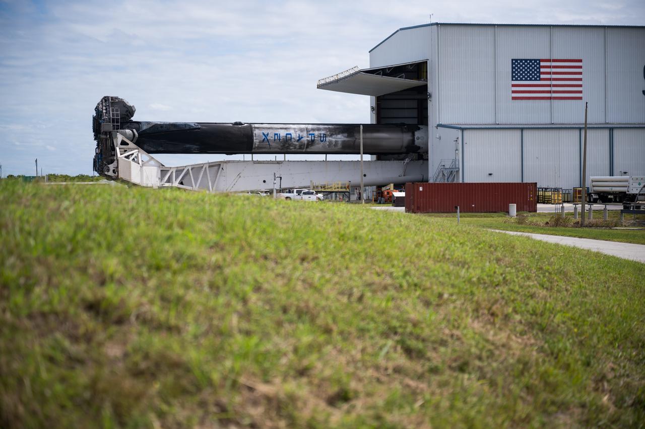 A SpaceX Falcon Heavy rocket with the Psyche spacecraft onboard is seen as it is rolled out of the horizontal integration facility at Launch Complex 39A as preparations continue for the Psyche mission, Tuesday, Oct. 10, 2023, at NASA’s Kennedy Space Center in Florida. NASA’s Psyche spacecraft will travel to a metal-rich asteroid by the same name orbiting the Sun between Mars and Jupiter to study it’s composition. The spacecraft also carries the agency's Deep Space Optical Communications technology demonstration, which will test laser communications beyond the Moon. Photo Credit: (NASA/Aubrey Gemignani)