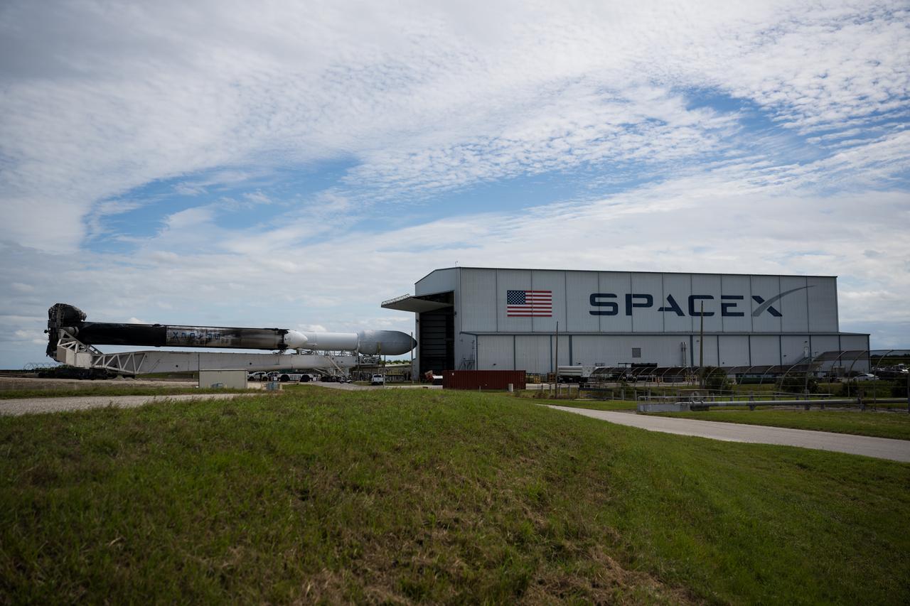 A SpaceX Falcon Heavy rocket with the Psyche spacecraft onboard is seen as it is rolled out of the horizontal integration facility at Launch Complex 39A as preparations continue for the Psyche mission, Tuesday, Oct. 10, 2023, at NASA’s Kennedy Space Center in Florida. NASA’s Psyche spacecraft will travel to a metal-rich asteroid by the same name orbiting the Sun between Mars and Jupiter to study it’s composition. The spacecraft also carries the agency's Deep Space Optical Communications technology demonstration, which will test laser communications beyond the Moon. Photo Credit: (NASA/Aubrey Gemignani)