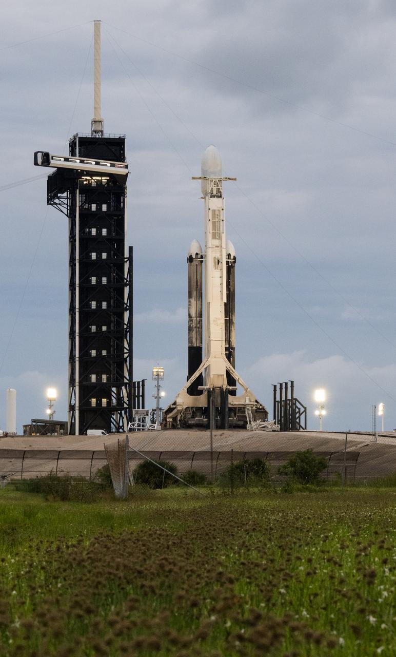 A SpaceX Falcon Heavy rocket with the Psyche spacecraft onboard is seen at Launch Complex 39A as preparations continue for the Psyche mission, Wednesday, Oct. 11, 2023, at NASA’s Kennedy Space Center in Florida. NASA’s Psyche spacecraft will travel to a metal-rich asteroid by the same name orbiting the Sun between Mars and Jupiter to study it’s composition. The spacecraft also carries the agency's Deep Space Optical Communications technology demonstration, which will test laser communications beyond the Moon. Photo Credit: (NASA/Aubrey Gemignani)