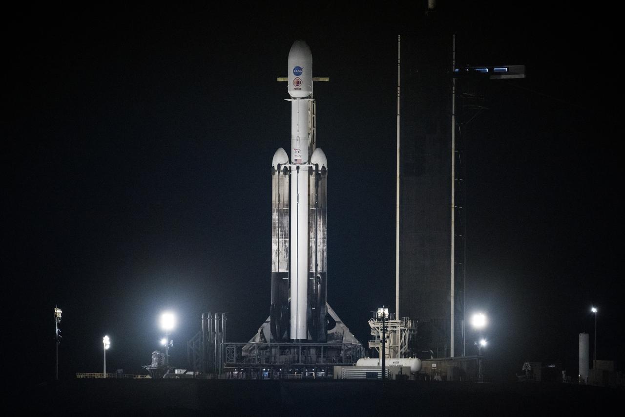 A SpaceX Falcon Heavy rocket with the Psyche spacecraft onboard is seen at Launch Complex 39A as preparations continue for the Psyche mission, Thursday, Oct. 12, 2023, at NASA’s Kennedy Space Center in Florida. NASA’s Psyche spacecraft will travel to a metal-rich asteroid by the same name orbiting the Sun between Mars and Jupiter to study it’s composition. The spacecraft also carries the agency's Deep Space Optical Communications technology demonstration, which will test laser communications beyond the Moon. Photo Credit: (NASA/Aubrey Gemignani)