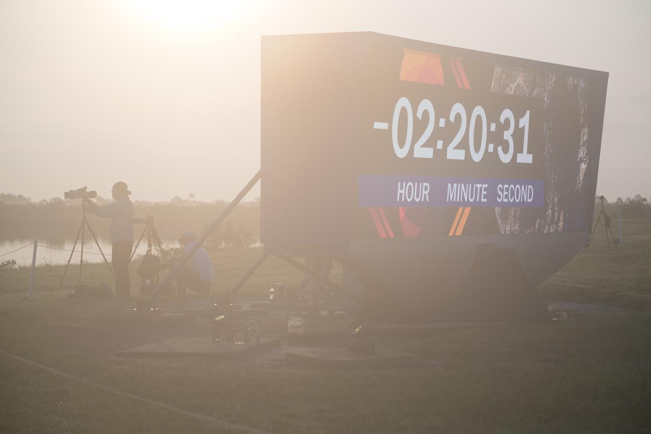 The countdown clock is seen as preparations continue for the launch of a SpaceX Falcon Heavy rocket with the Psyche spacecraft onboard from Launch Complex 39A, Friday, Oct. 13, 2023, at NASA’s Kennedy Space Center in Florida. NASA’s Psyche spacecraft will travel to a metal-rich asteroid by the same name orbiting the Sun between Mars and Jupiter to study it’s composition. The spacecraft also carries the agency's Deep Space Optical Communications technology demonstration, which will test laser communications beyond the Moon. Photo Credit: (NASA/Aubrey Gemignani)
