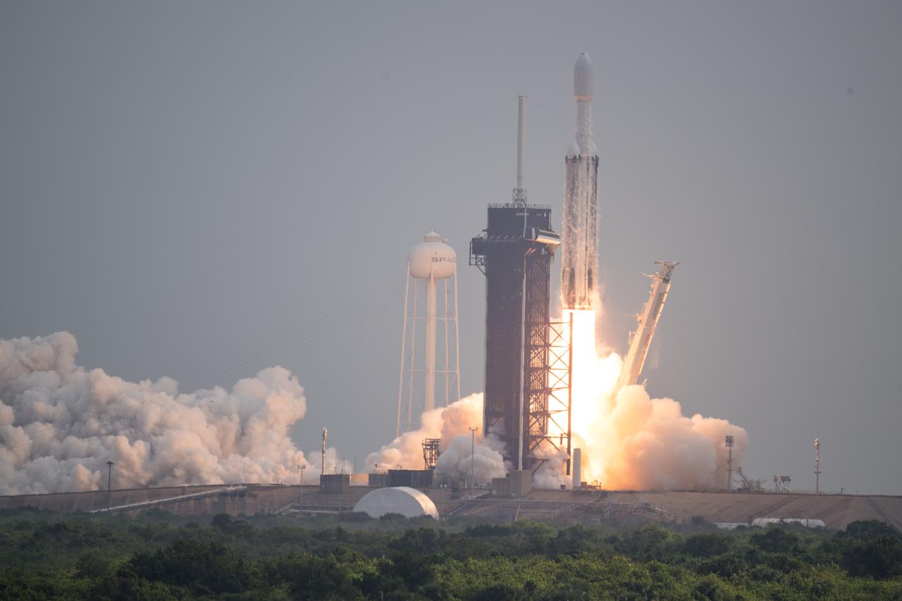 A SpaceX Falcon Heavy rocket with the Psyche spacecraft onboard is launched from Launch Complex 39A, Friday, Oct. 13, 2023, at NASA’s Kennedy Space Center in Florida. NASA’s Psyche spacecraft will travel to a metal-rich asteroid by the same name orbiting the Sun between Mars and Jupiter to study it’s composition. The spacecraft also carries the agency's Deep Space Optical Communications technology demonstration, which will test laser communications beyond the Moon. Photo Credit: (NASA/Aubrey Gemignani)