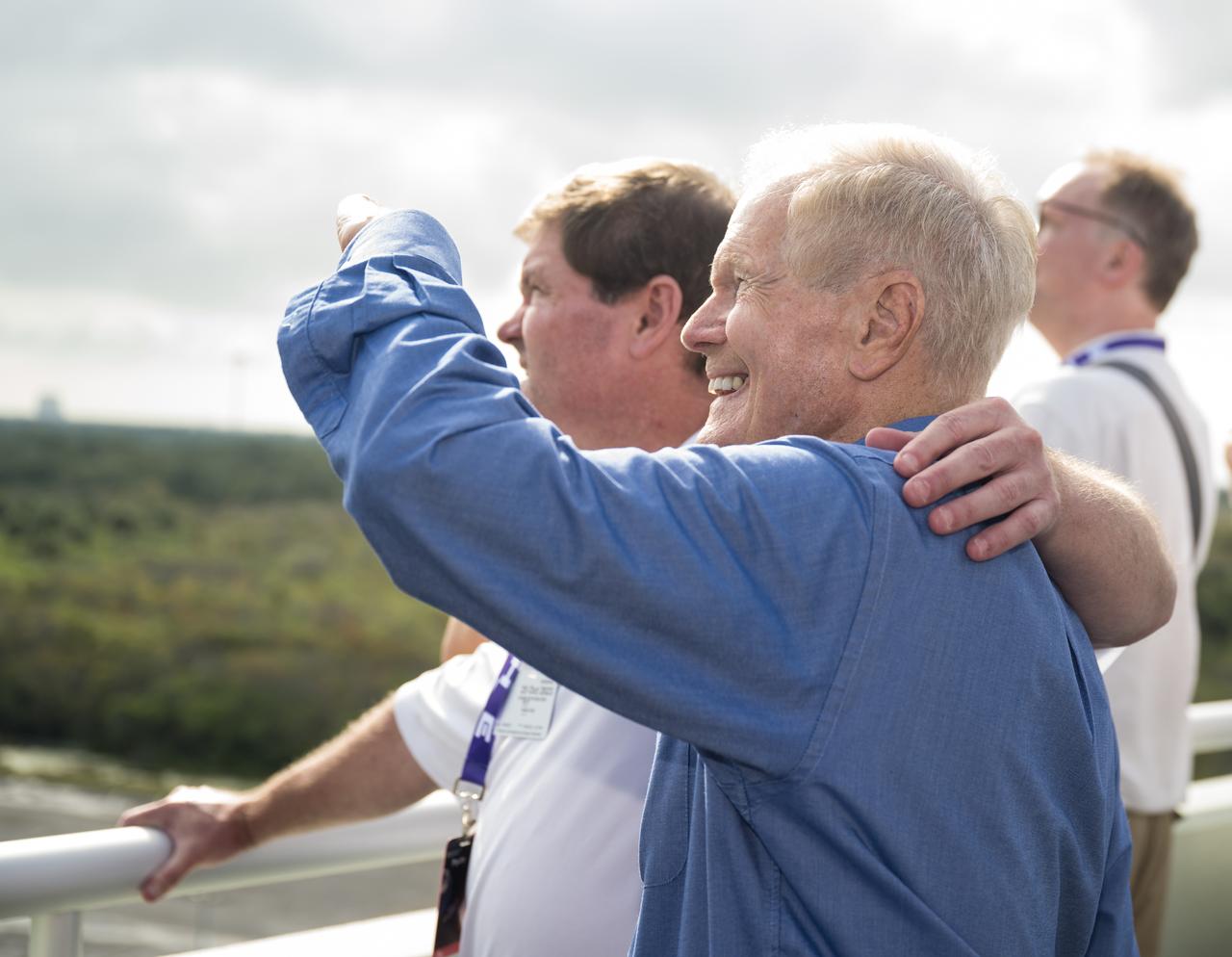 NASA Administrator Bill Nelson and his son Bill Nelson Jr. watch the launch of a SpaceX Falcon Heavy rocket with the Psyche spacecraft onboard from Launch Complex 39A, Friday, Oct. 13, 2023, at NASA’s Kennedy Space Center in Florida. NASA’s Psyche spacecraft will travel to a metal-rich asteroid by the same name orbiting the Sun between Mars and Jupiter to study it’s composition. The spacecraft also carries the agency's Deep Space Optical Communications technology demonstration, which will test laser communications beyond the Moon. Photo Credit: (NASA/Aubrey Gemignani)
