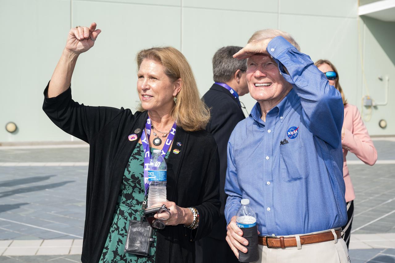 NASA Headquarters Planetary Science Division director Lori Glaze and NASA Administrator Bill Nelson watch for the return of the boosters after the launch of a SpaceX Falcon Heavy rocket with the Psyche spacecraft onboard from Launch Complex 39A, Friday, Oct. 13, 2023, at NASA’s Kennedy Space Center in Florida. NASA’s Psyche spacecraft will travel to a metal-rich asteroid by the same name orbiting the Sun between Mars and Jupiter to study it’s composition. The spacecraft also carries the agency's Deep Space Optical Communications technology demonstration, which will test laser communications beyond the Moon. Photo Credit: (NASA/Aubrey Gemignani)
