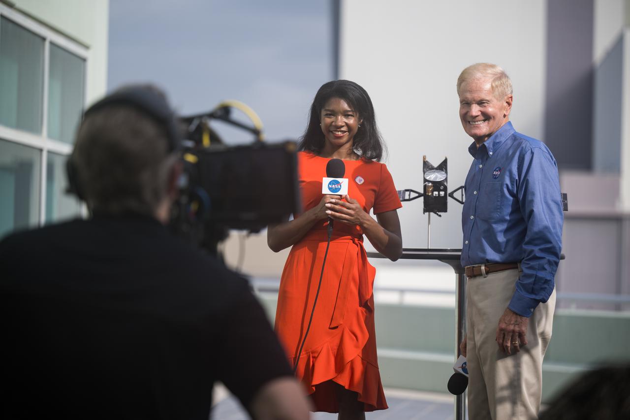 NASA Administrator Bill Nelson is interviewed by NASA public affairs specialist Jasmine Hopkins before the launch of a SpaceX Falcon Heavy rocket with the Psyche spacecraft onboard, Friday, Oct. 13, 2023, at NASA’s Kennedy Space Center in Florida. NASA’s Psyche spacecraft will travel to a metal-rich asteroid by the same name orbiting the Sun between Mars and Jupiter to study it’s composition. The spacecraft also carries the agency's Deep Space Optical Communications technology demonstration, which will test laser communications beyond the Moon. Photo Credit: (NASA/Aubrey Gemignani)