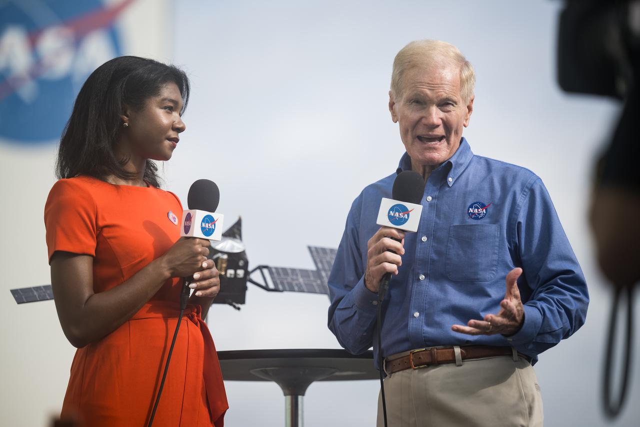 NASA Administrator Bill Nelson is interviewed by NASA public affairs specialist Jasmine Hopkins before the launch of a SpaceX Falcon Heavy rocket with the Psyche spacecraft onboard, Friday, Oct. 13, 2023, at NASA’s Kennedy Space Center in Florida. NASA’s Psyche spacecraft will travel to a metal-rich asteroid by the same name orbiting the Sun between Mars and Jupiter to study it’s composition. The spacecraft also carries the agency's Deep Space Optical Communications technology demonstration, which will test laser communications beyond the Moon. Photo Credit: (NASA/Aubrey Gemignani)